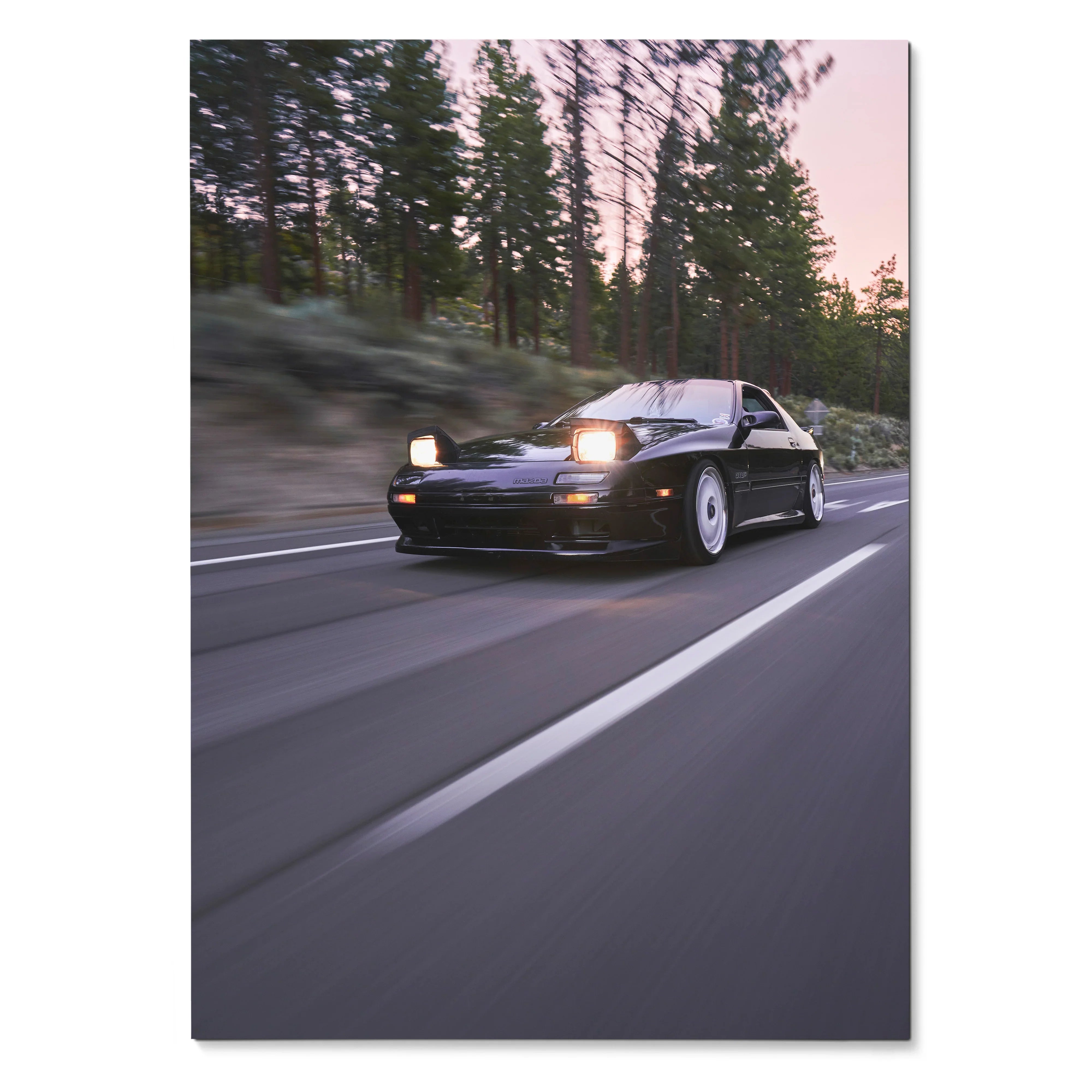Mazda FC RX7 driving on road at dusk with headlights on poster wall art.