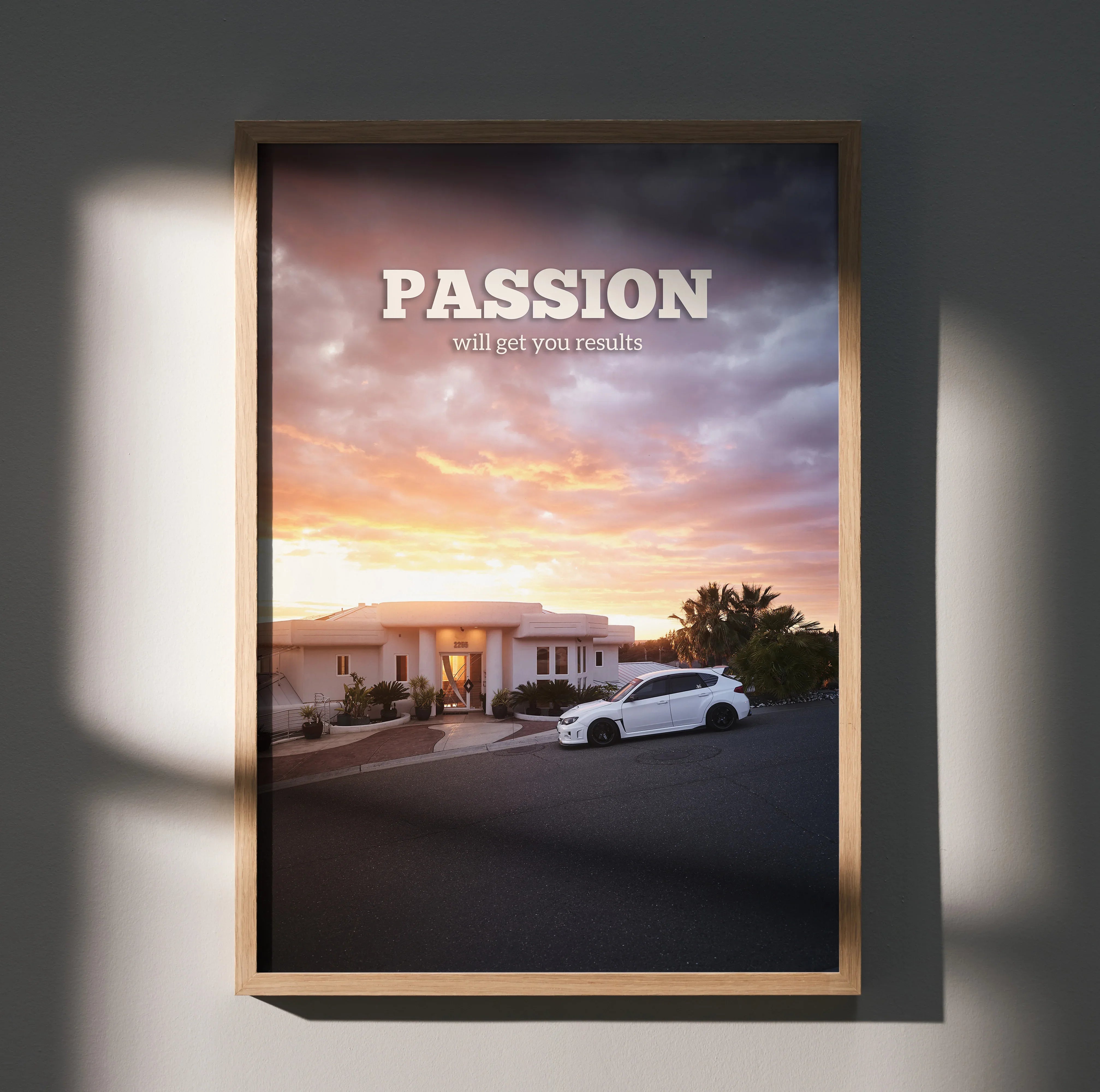 Subaru WRX STI motivational poster wall art with sunset and white car in driveway.