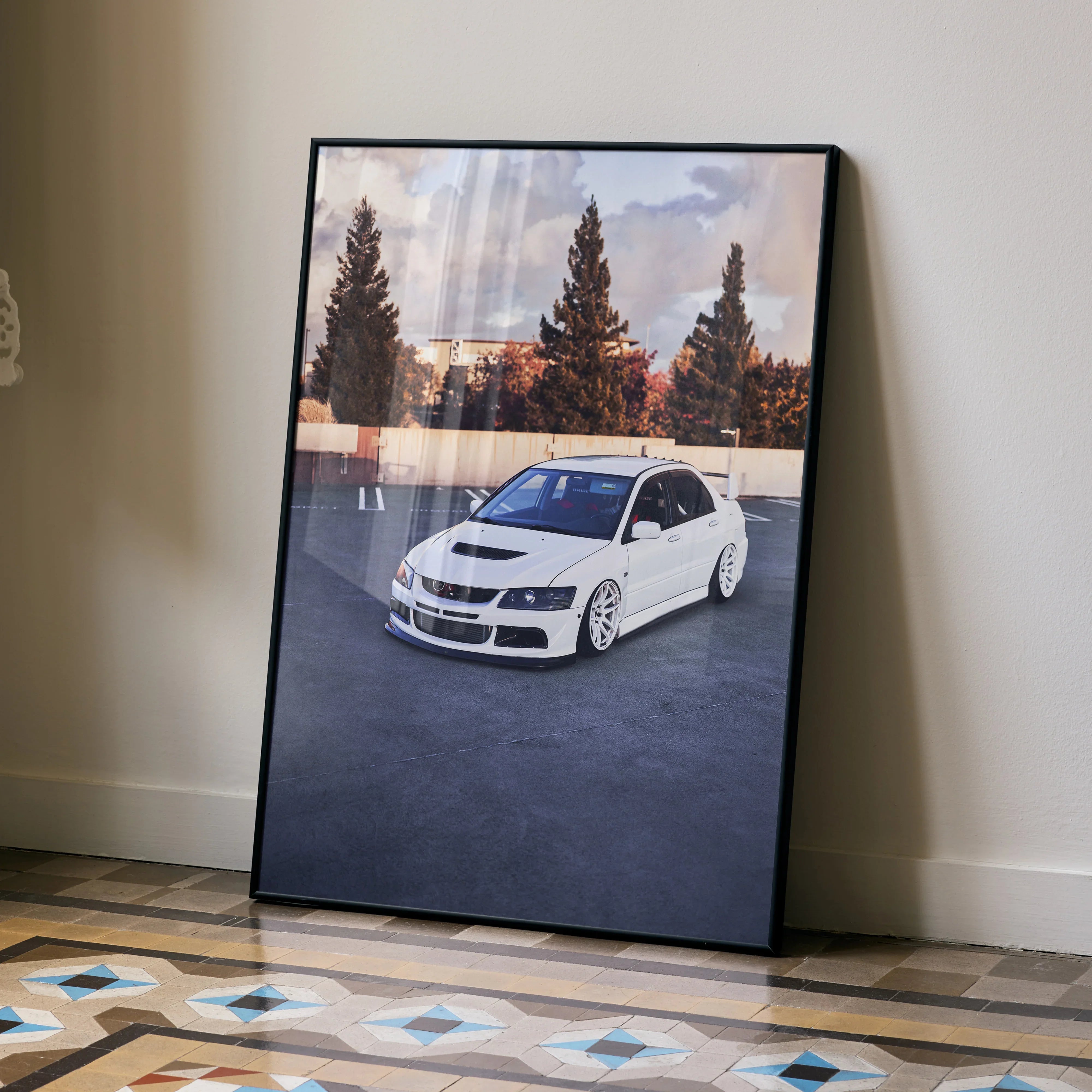 Mitsubishi Evo 8 white car poster with sunset and trees wall art in black frame.
