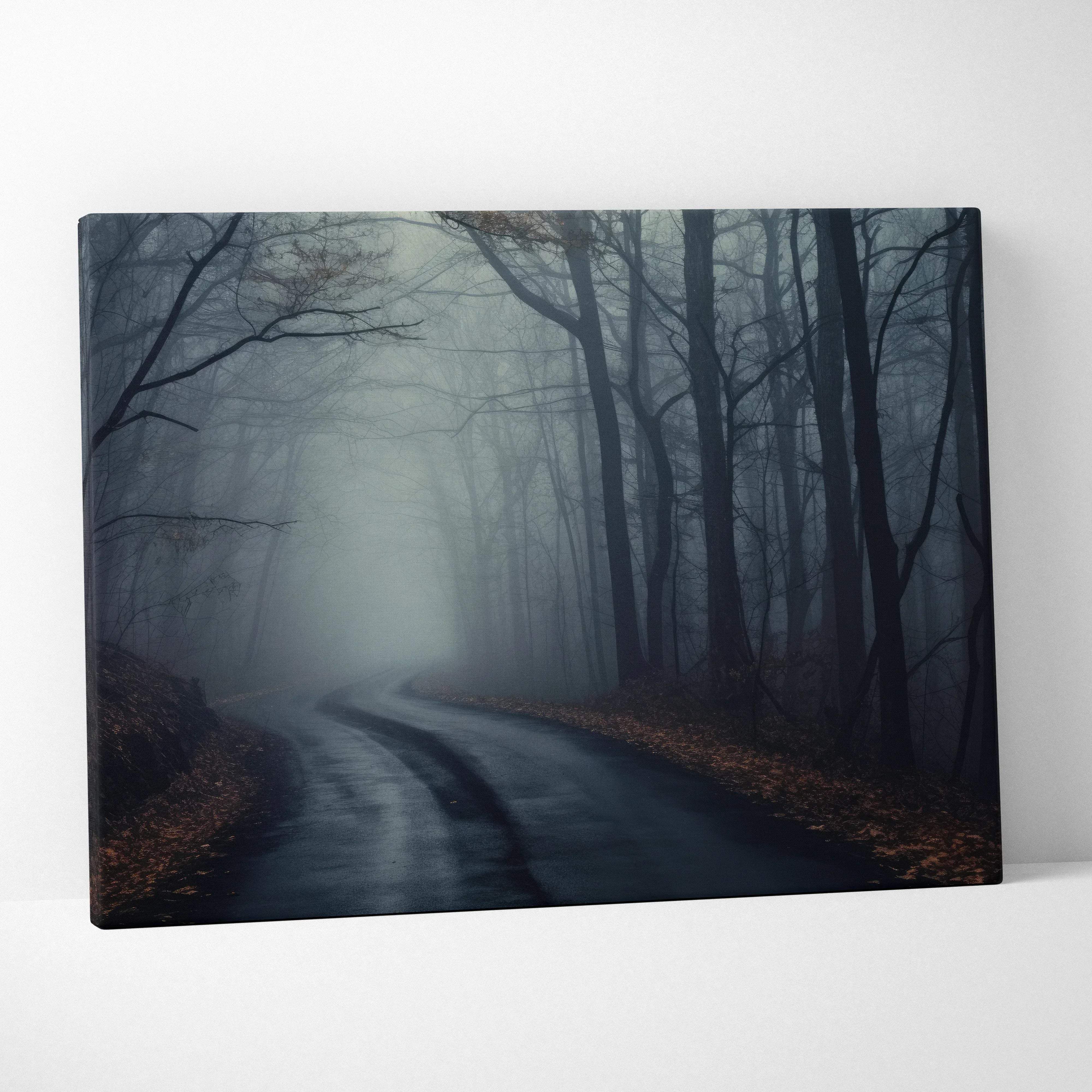 Moody atmospheric forest canvas wall art featuring a misty road with bare trees and fallen leaves in blue tones
