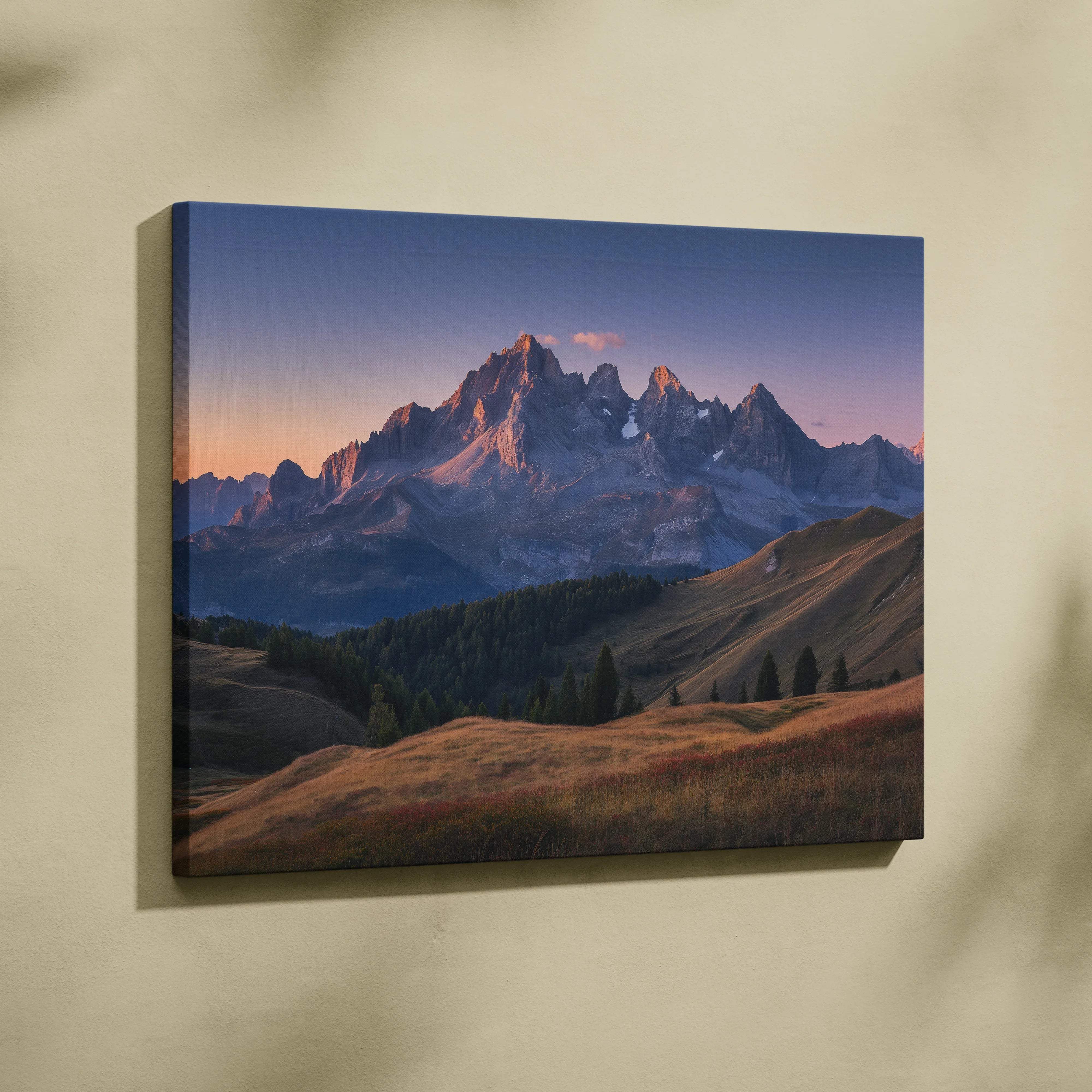 Canvas print of dramatic mountain range at sunset in lavender sky golden tones