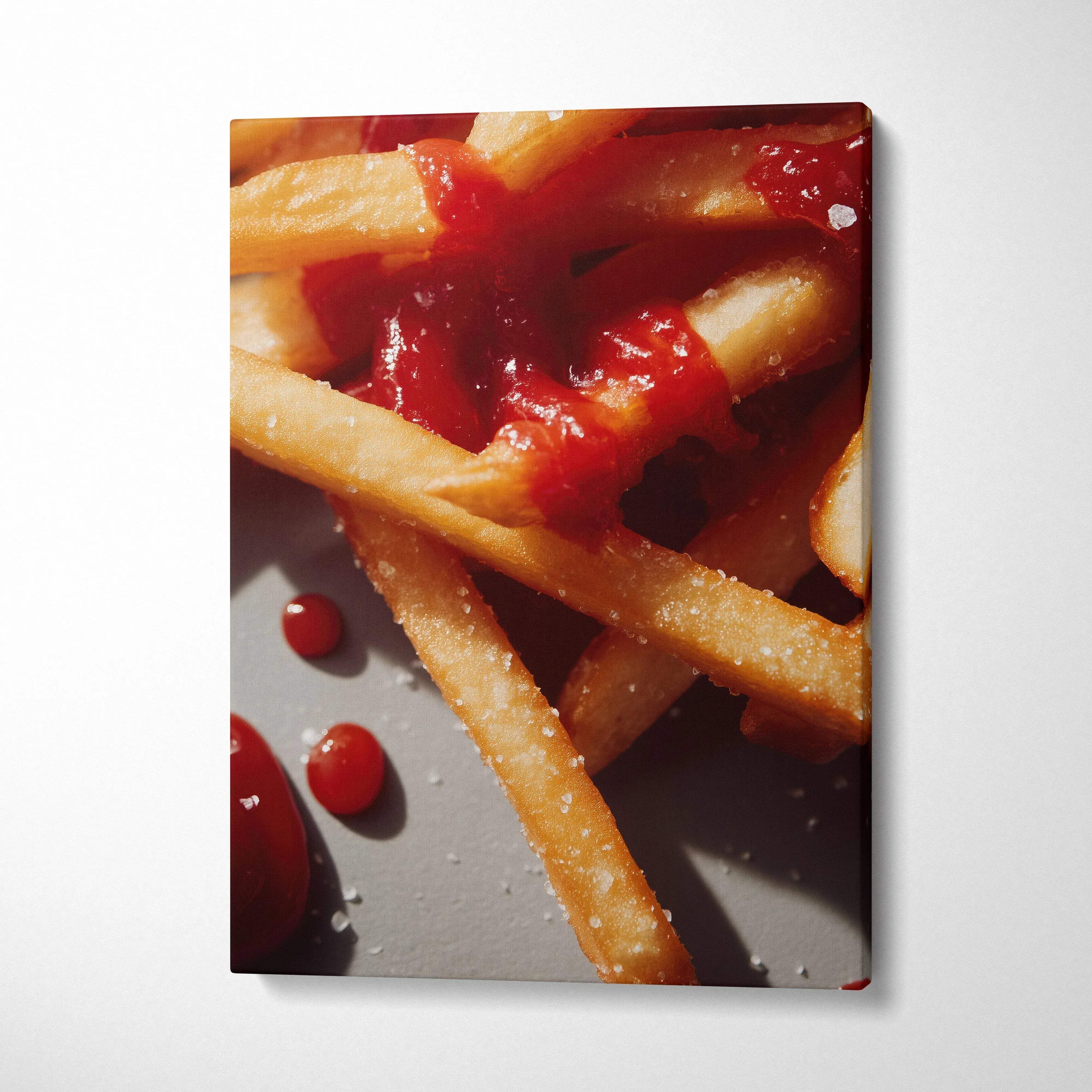 Canvas wall art featuring close-up of golden French fries with vibrant red ketchup for home decor.