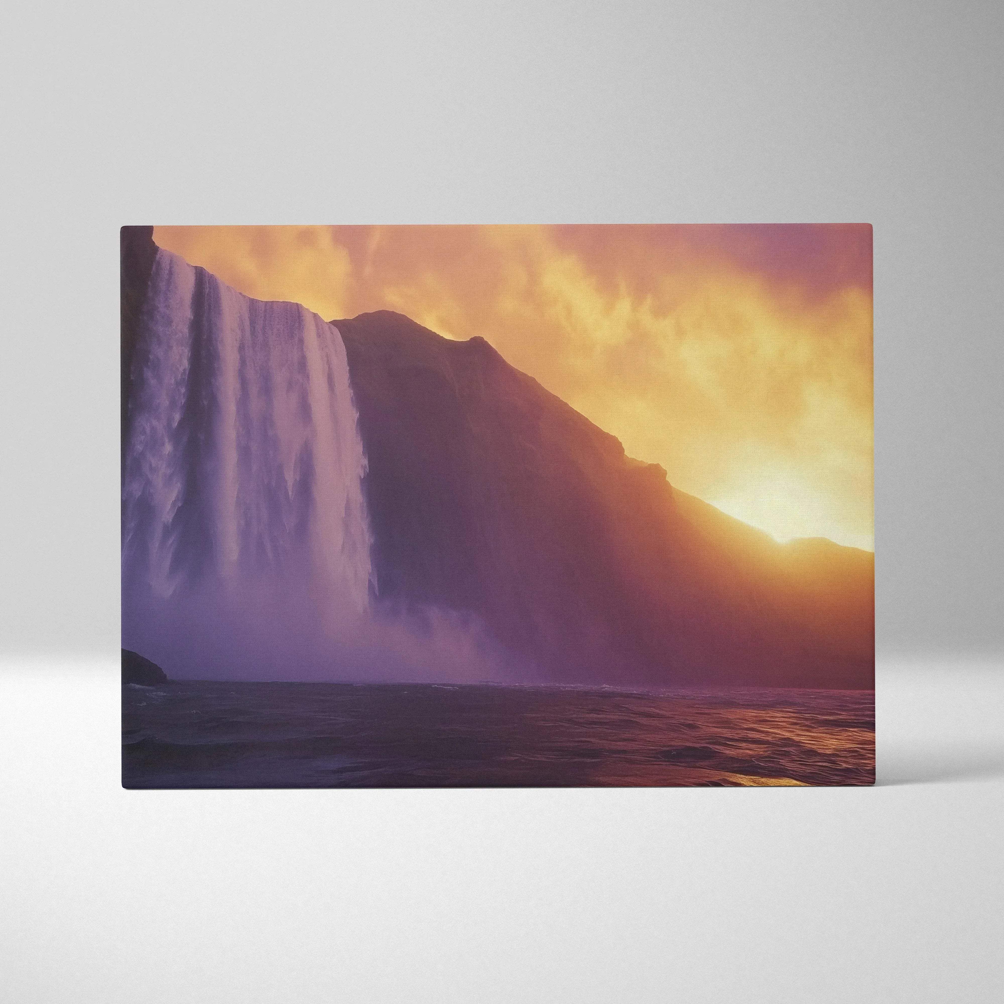 A rectangular canvas print of a waterfall at sunset with warm orange and purple hues for nature wall art