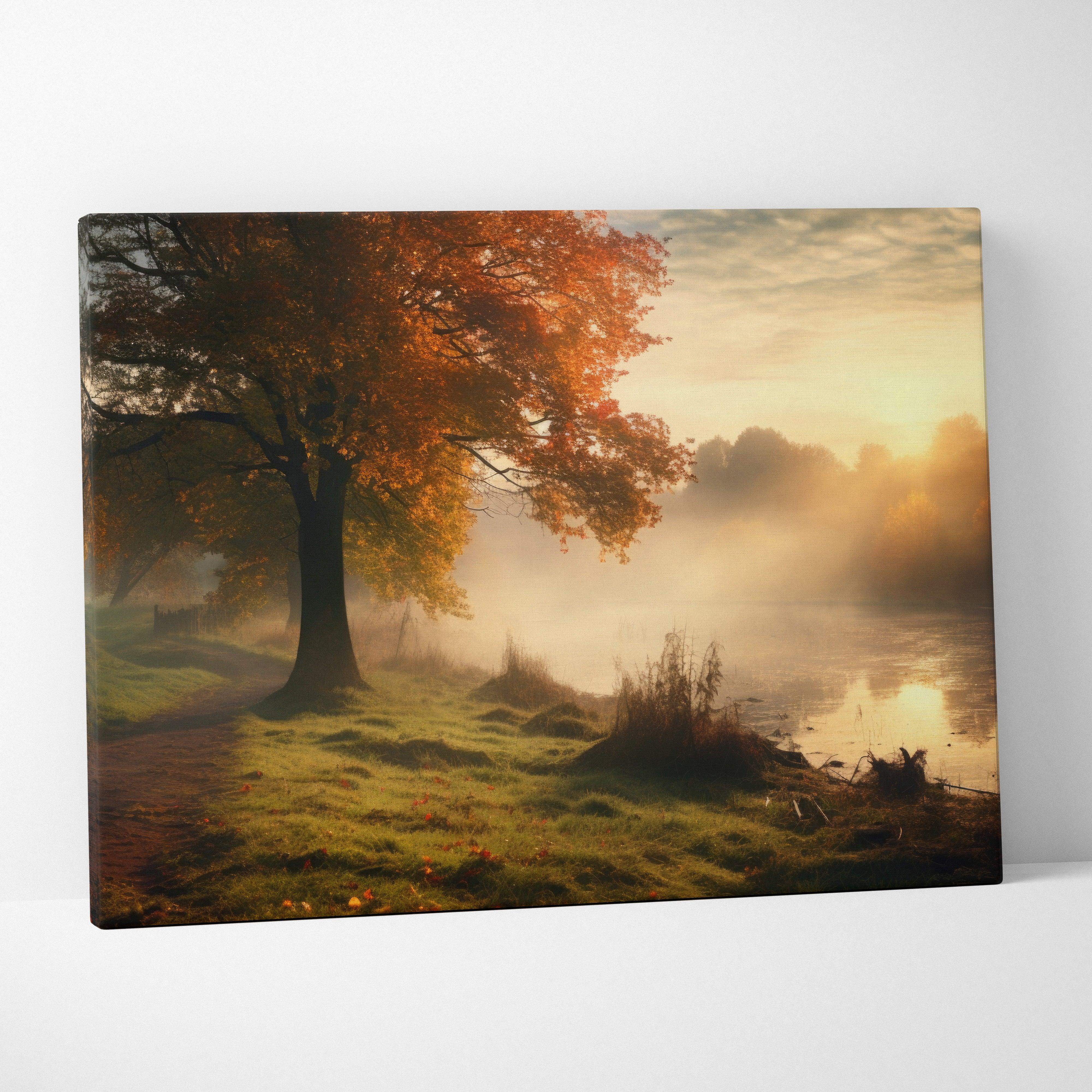 Canvas wall art of a solitary tree with orange and yellow autumn leaves by misty lake at sunrise in warm golden tones