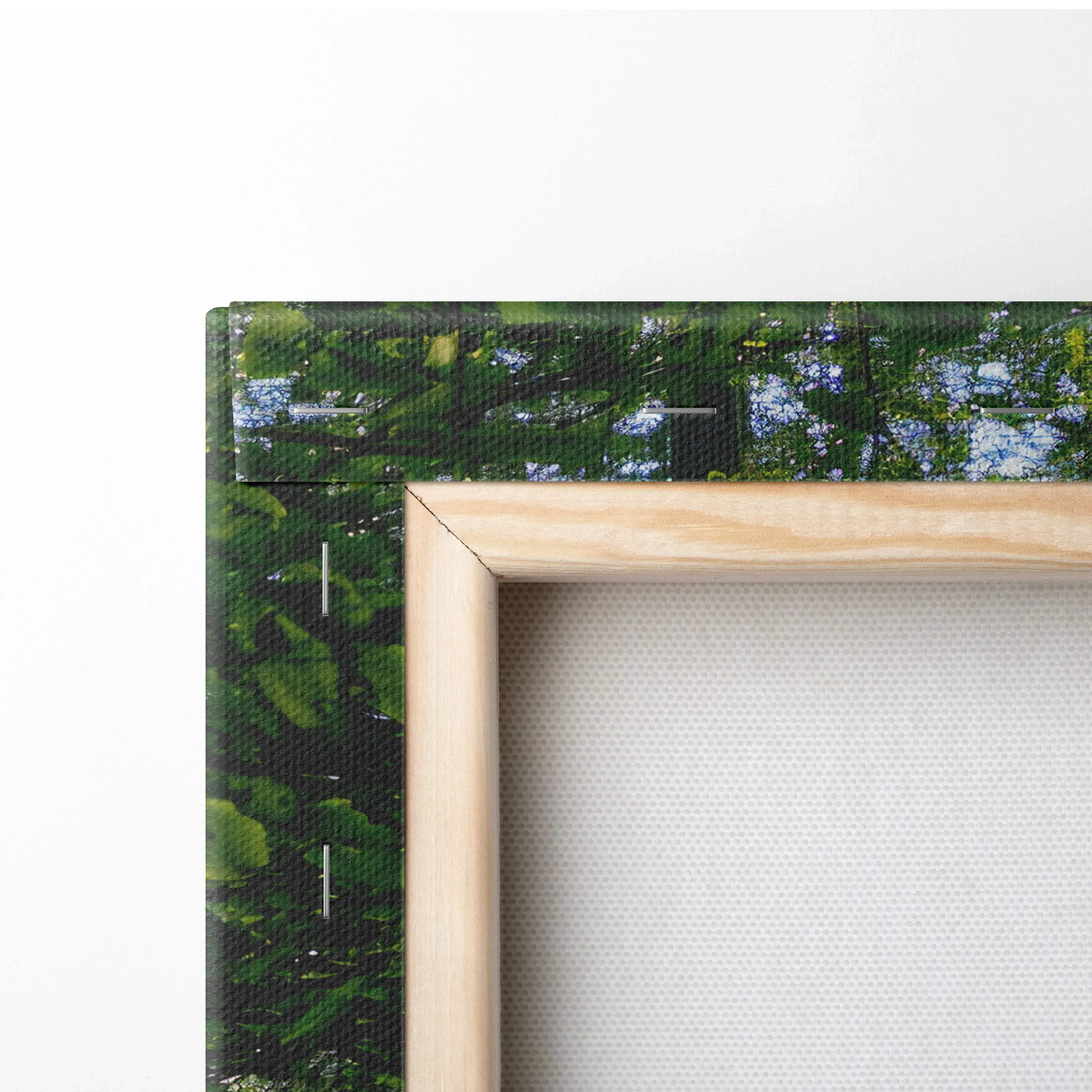 Light wood-framed canvas wall art featuring a vibrant green forest scene with dappled blue sky and sunlit rays