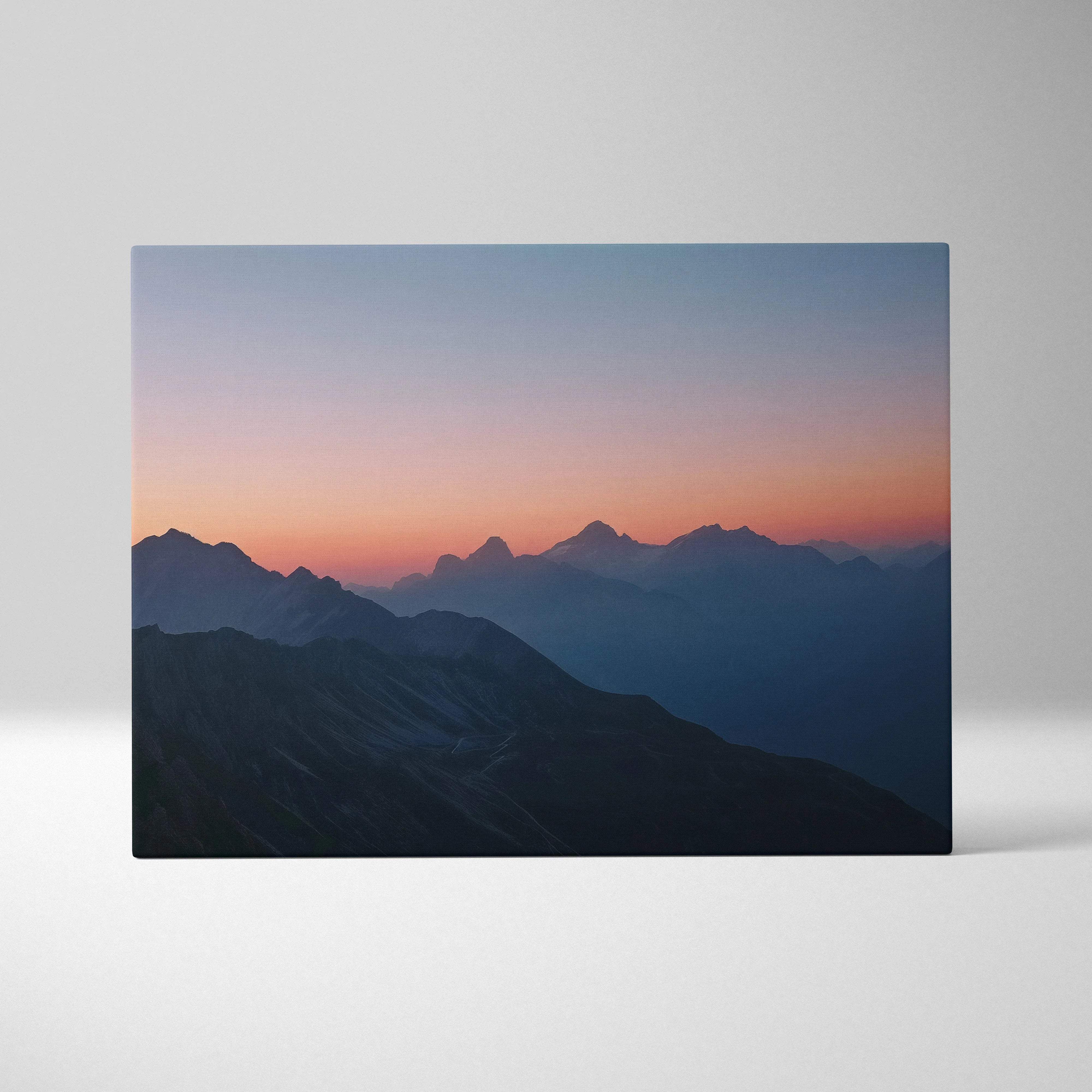 Canvas print of mountain landscape at dusk in lilac coral blue hues