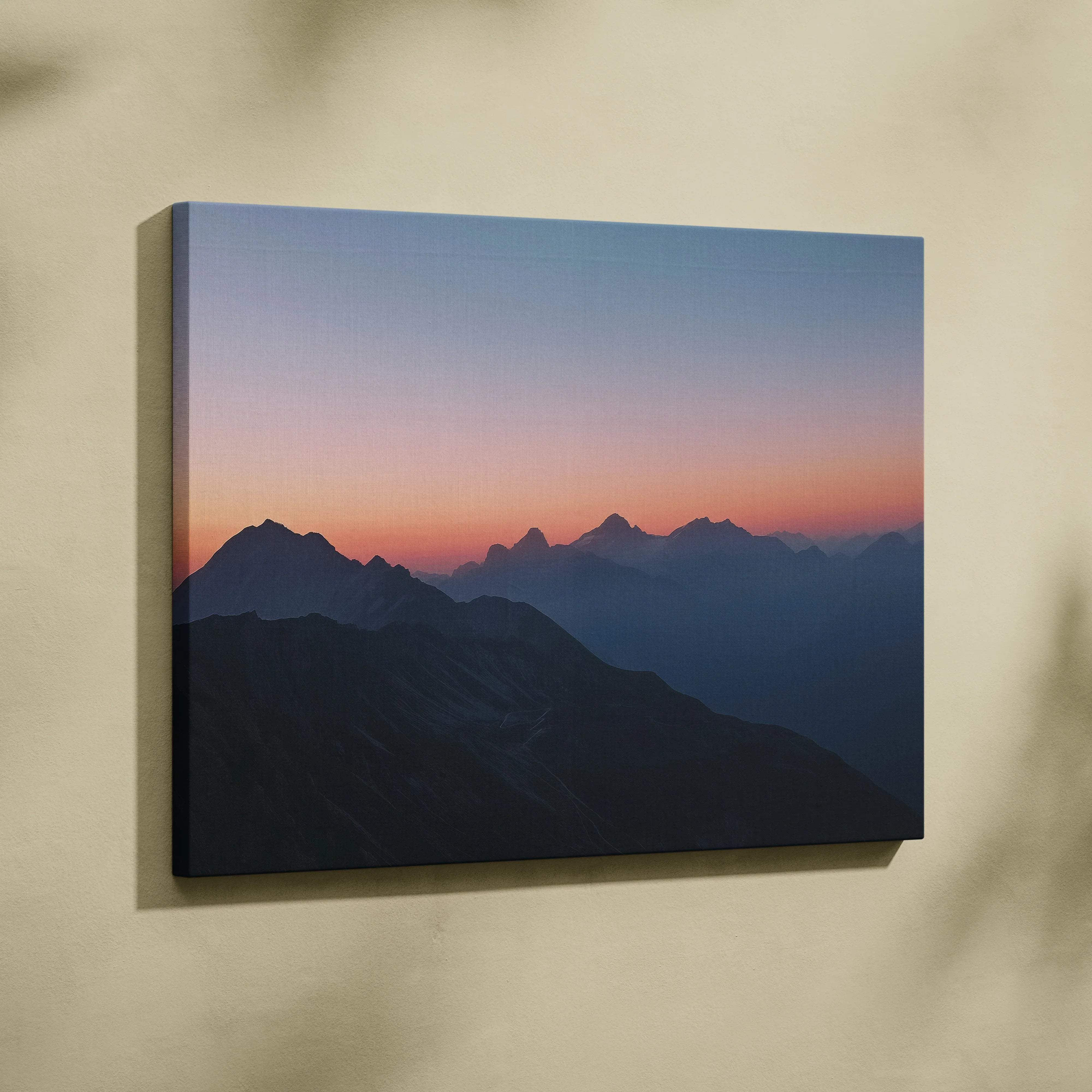 Canvas print of serene mountain range at dusk in lilac coral blue hues