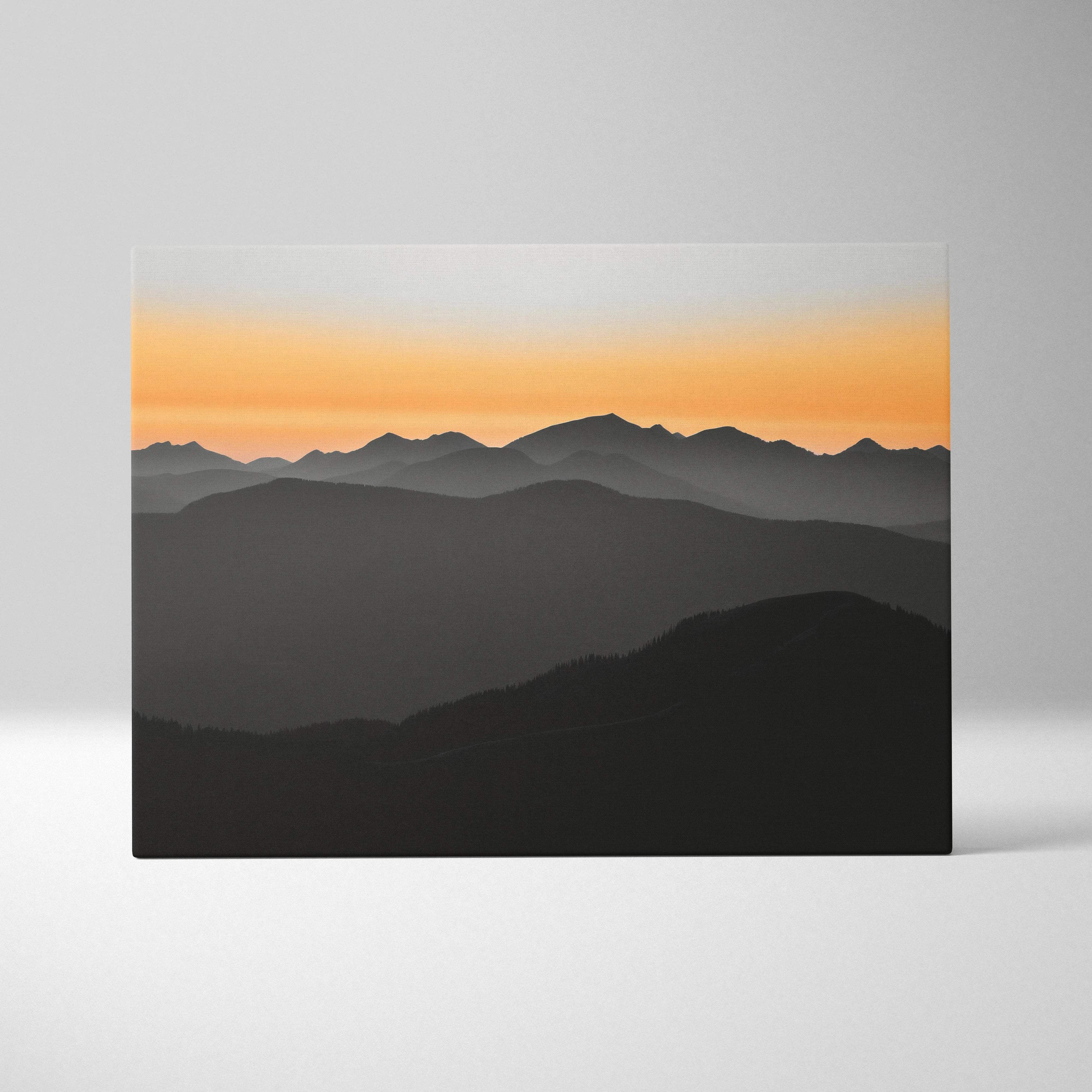 Minimalist layered mountain landscape canvas wall art with orange to gray sunset gradient