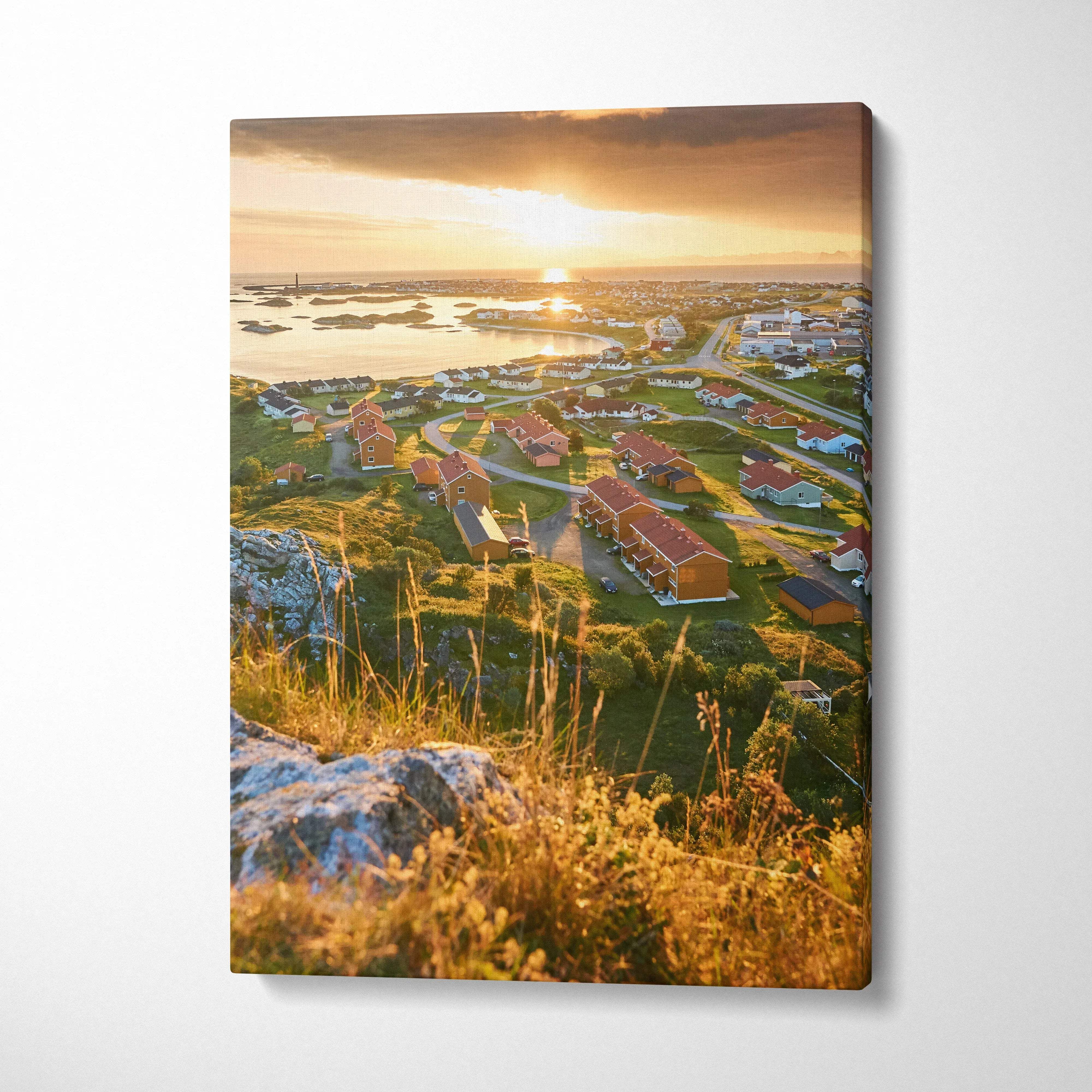 Vertical canvas wall art of Norwegian coastal town architecture at sunset with vibrant lighting.