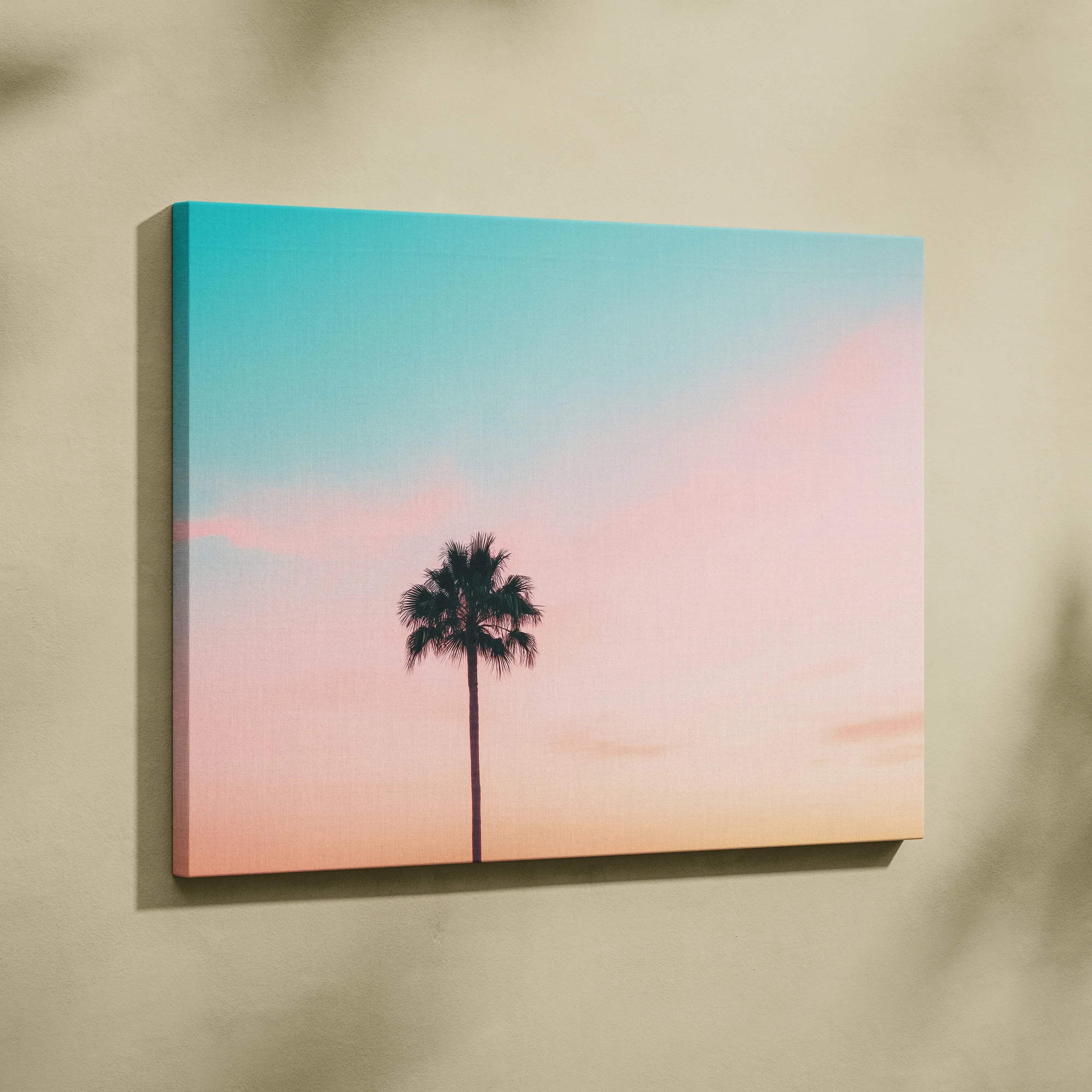 Minimalist rectangular canvas wall art featuring a solitary palm tree silhouette against a pastel sunset sky in peach and turquoise