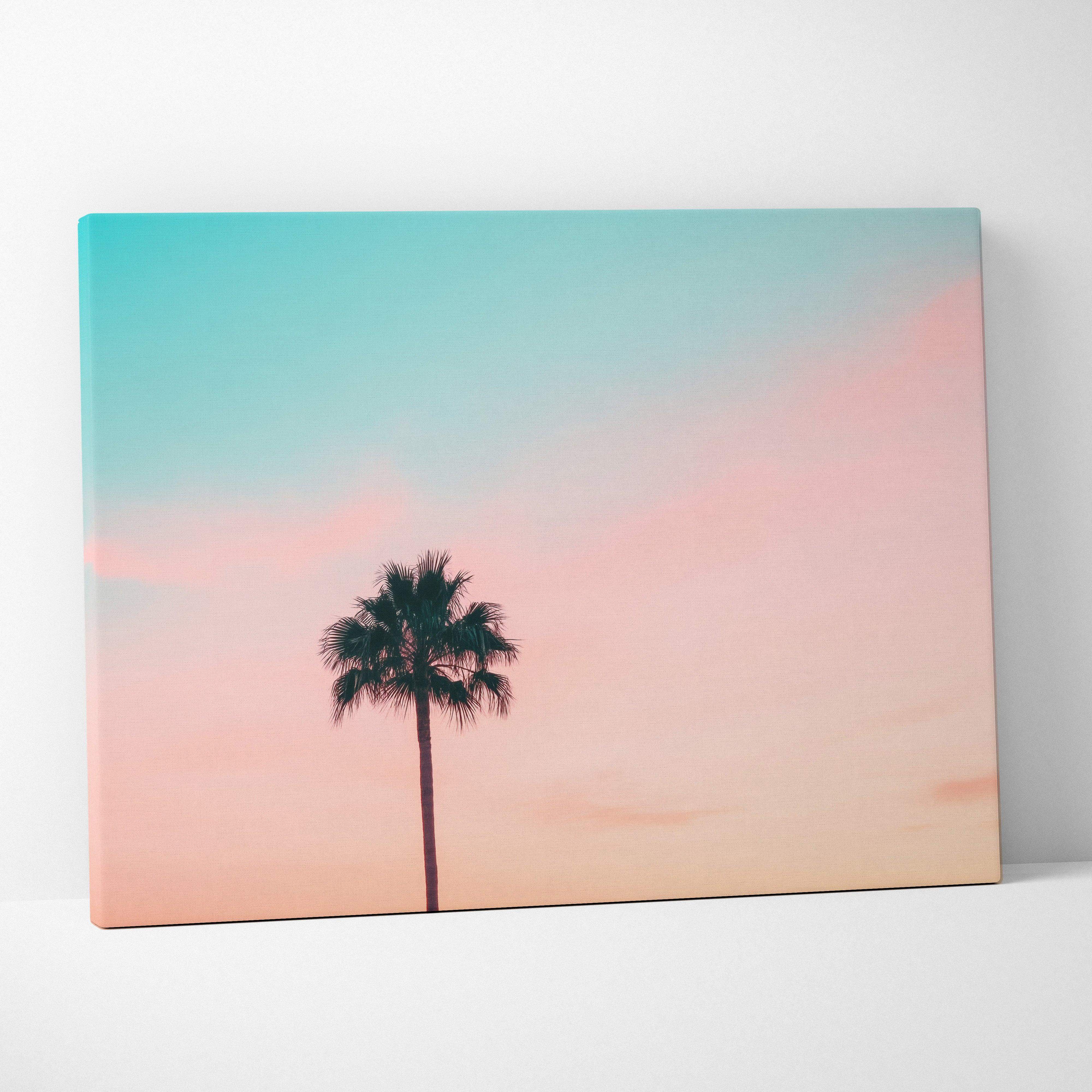 Minimalist palm tree silhouette canvas wall art with a teal to pink gradient pastel sunset sky background