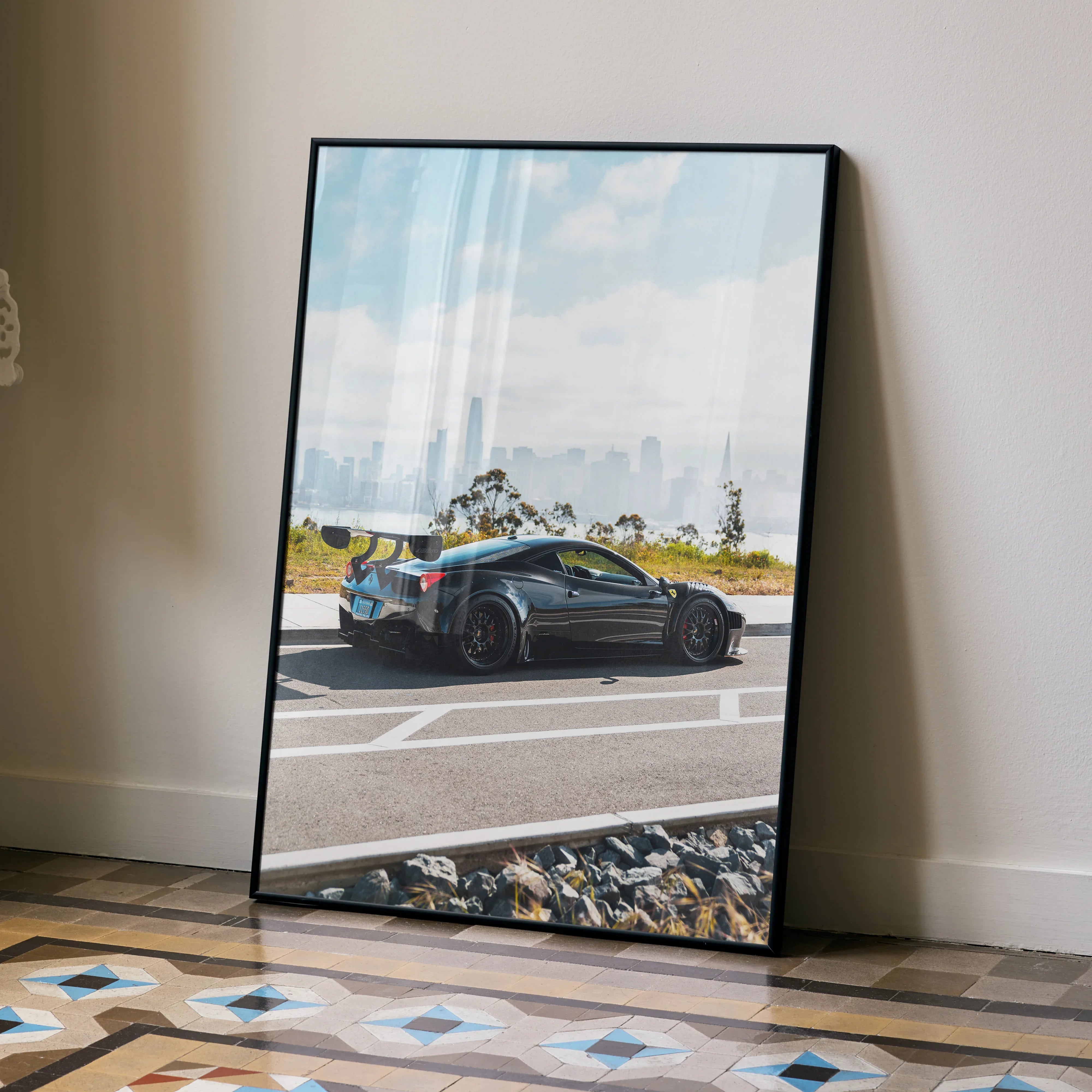 Ferrari 458 Italia GT3 poster featuring black race car on racetrack under blue sky wall art.