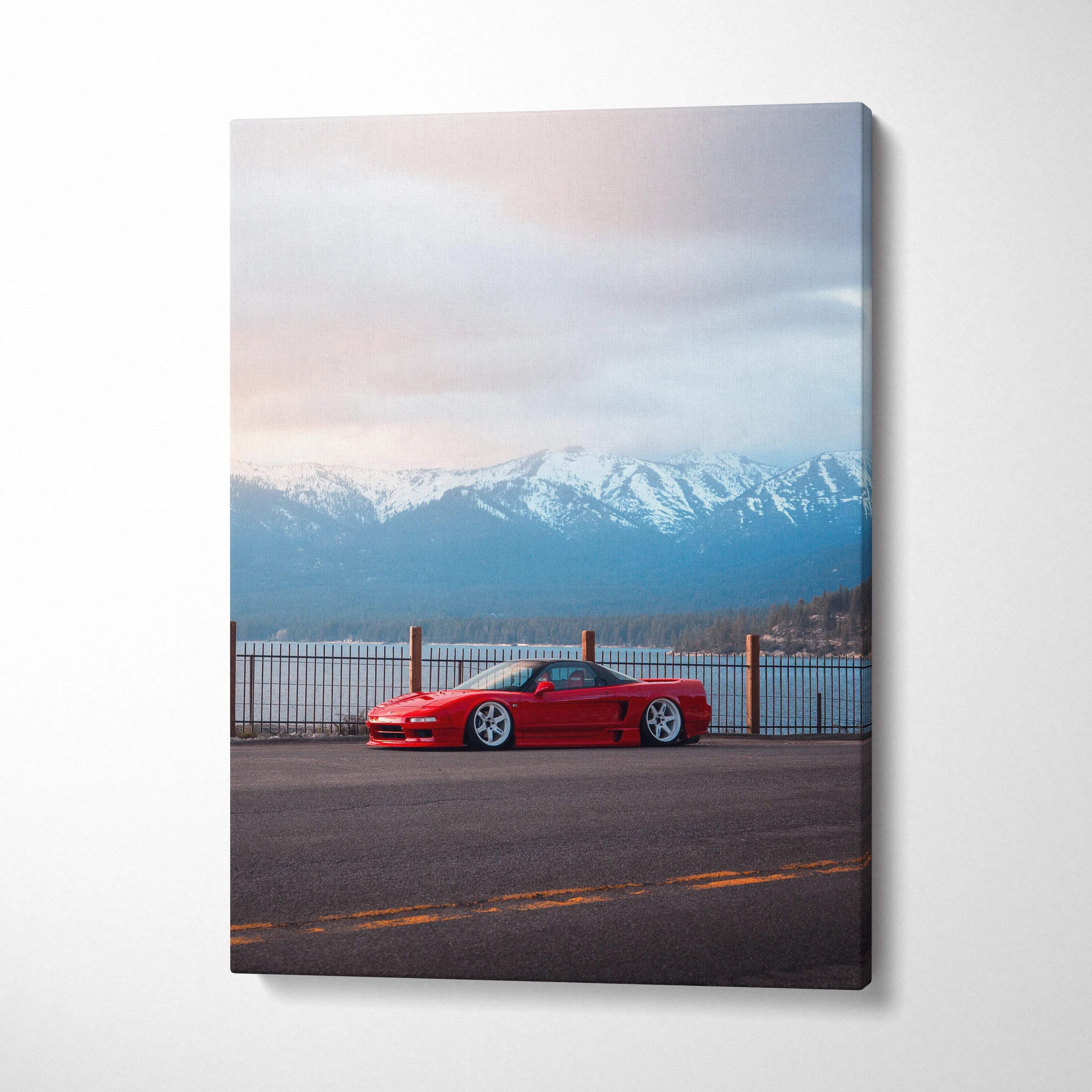 Red Acura NSX parked on road with snowy mountains in background canvas wall art.