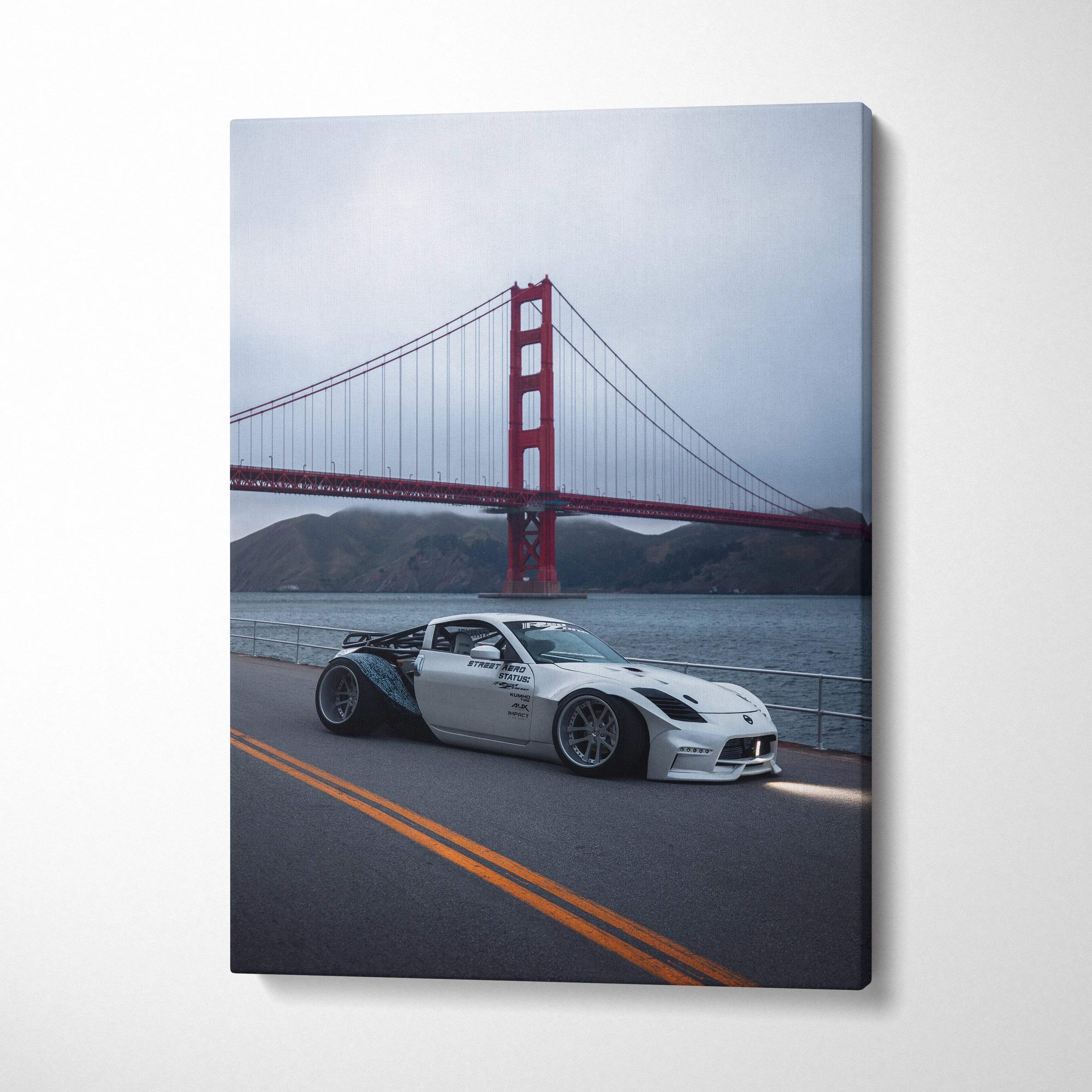 Nissan 350z car in front of Golden Gate Bridge canvas wall art with muted sky background.