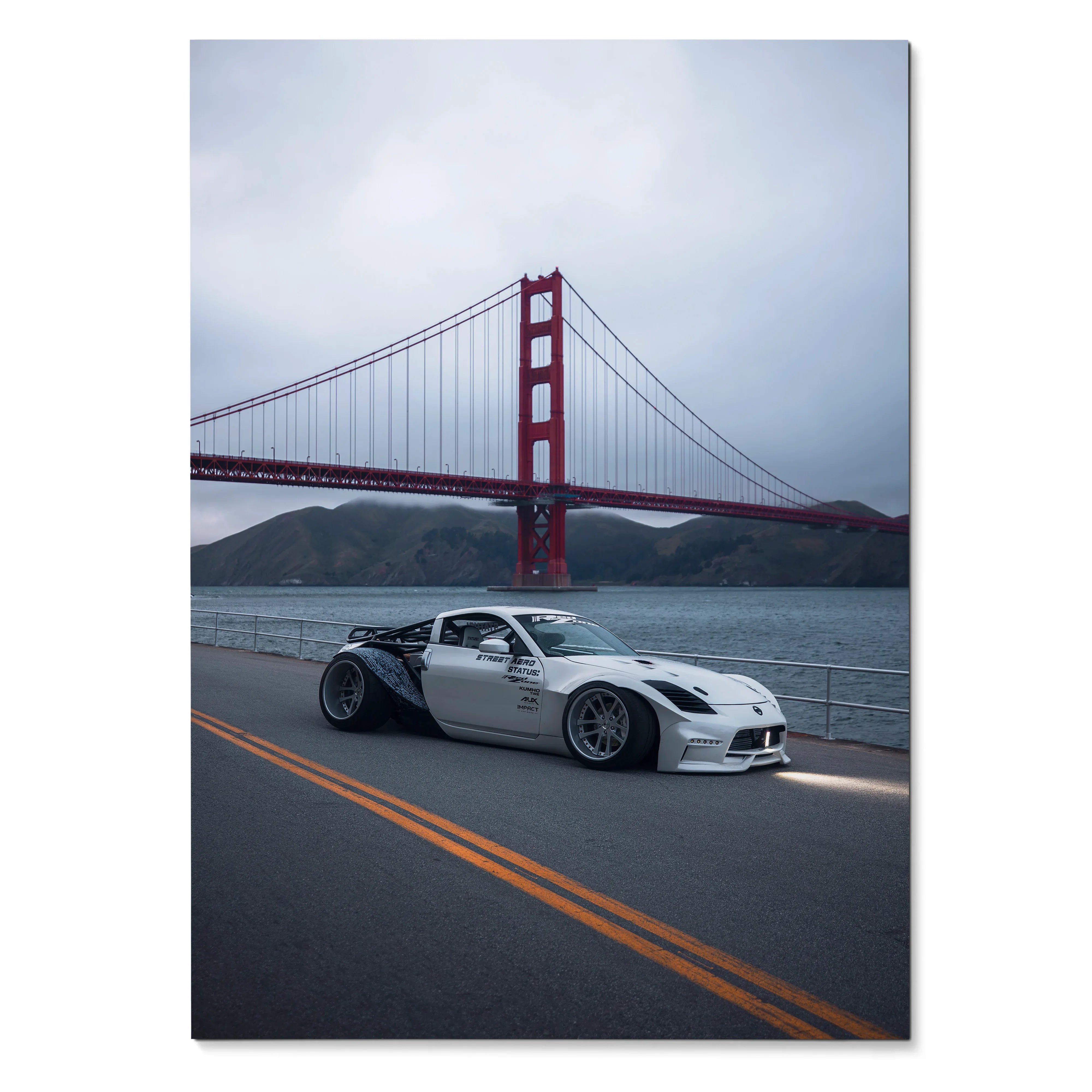 White Nissan 350z widebody on road with Golden Gate Bridge in background poster wall art.