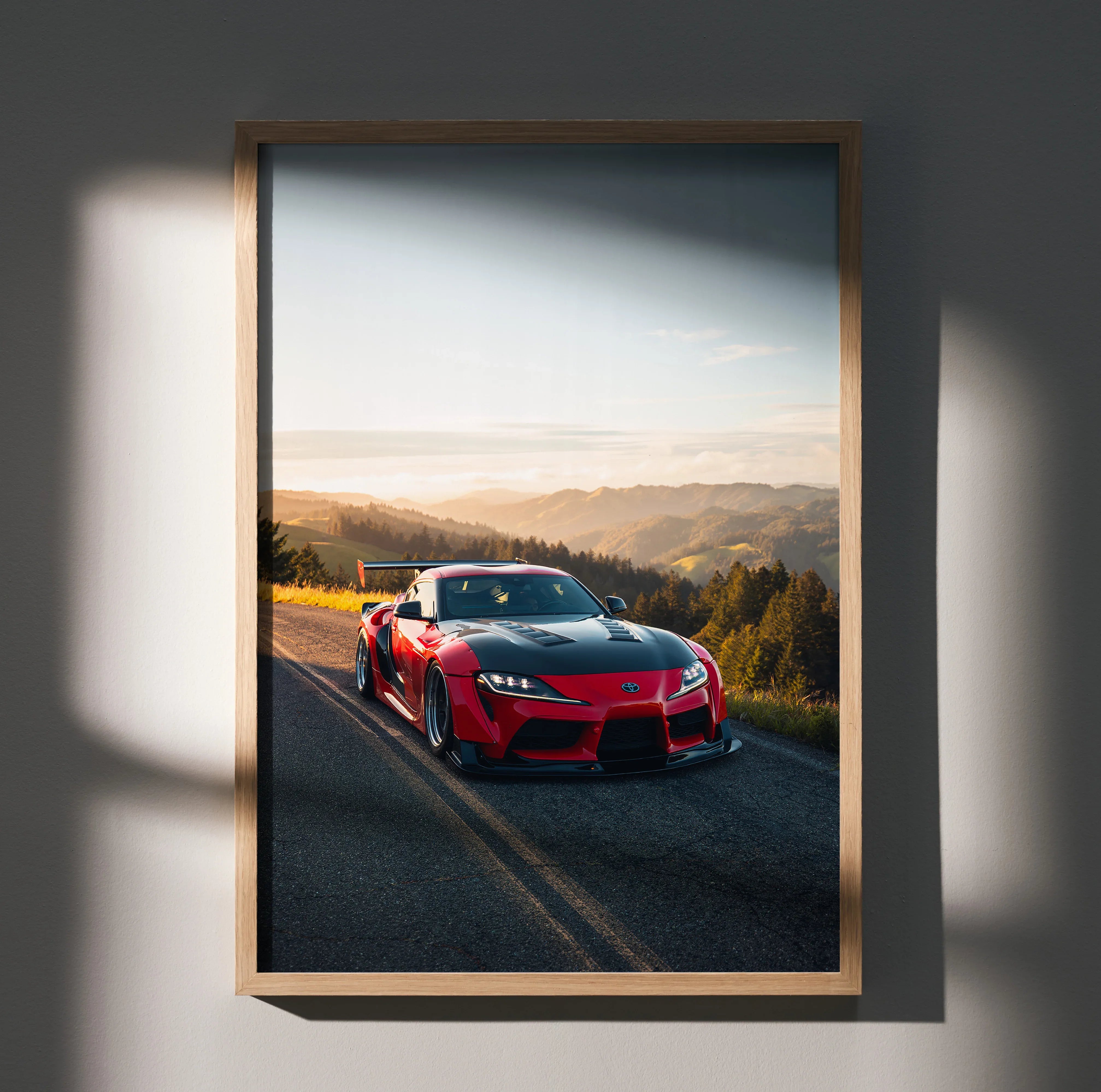 Toyota Supra Mk5 poster with red sports car on road at sunset, premium satin wall art.