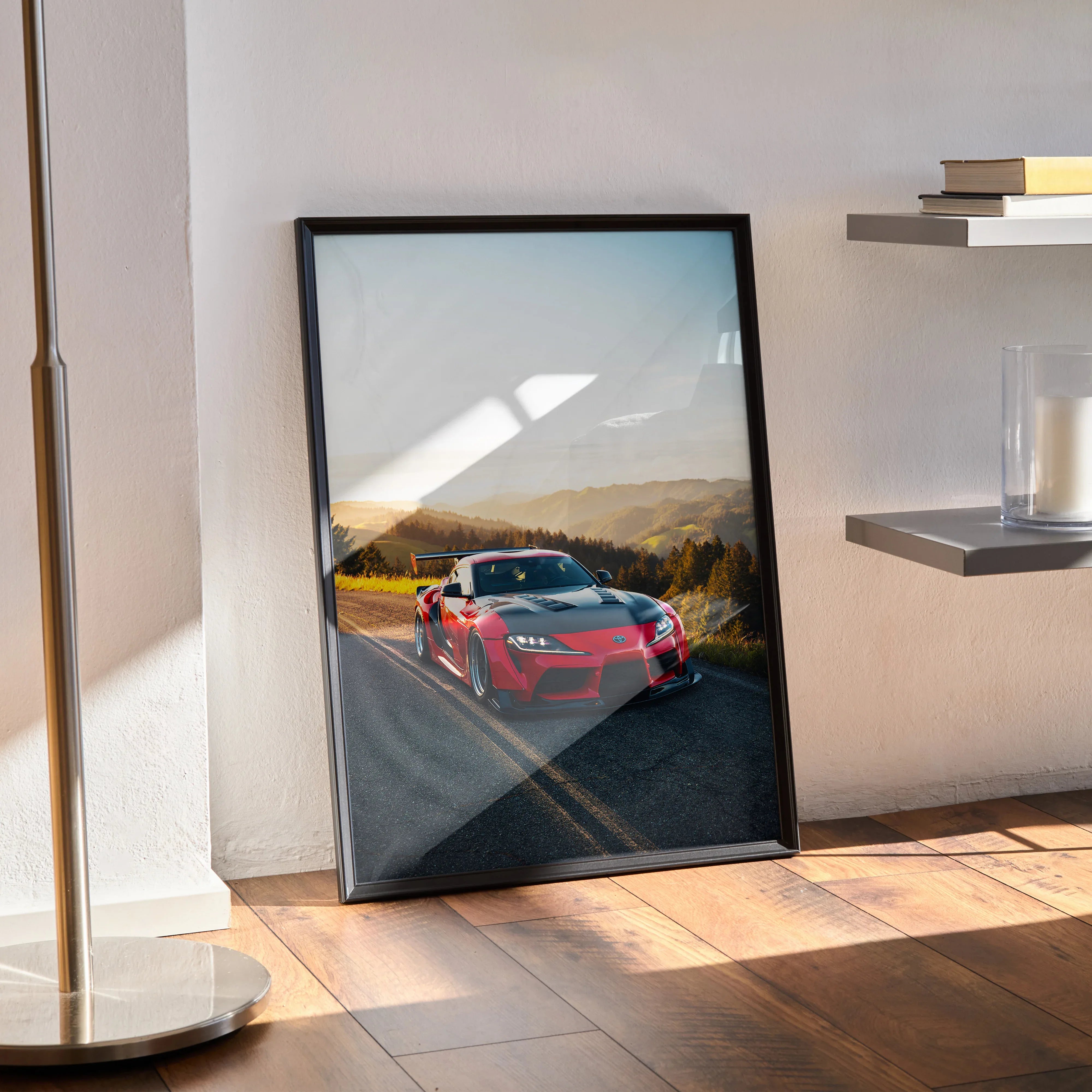 Toyota Supra Mk5 red sports car on scenic road at sunset poster wall art in black frame.