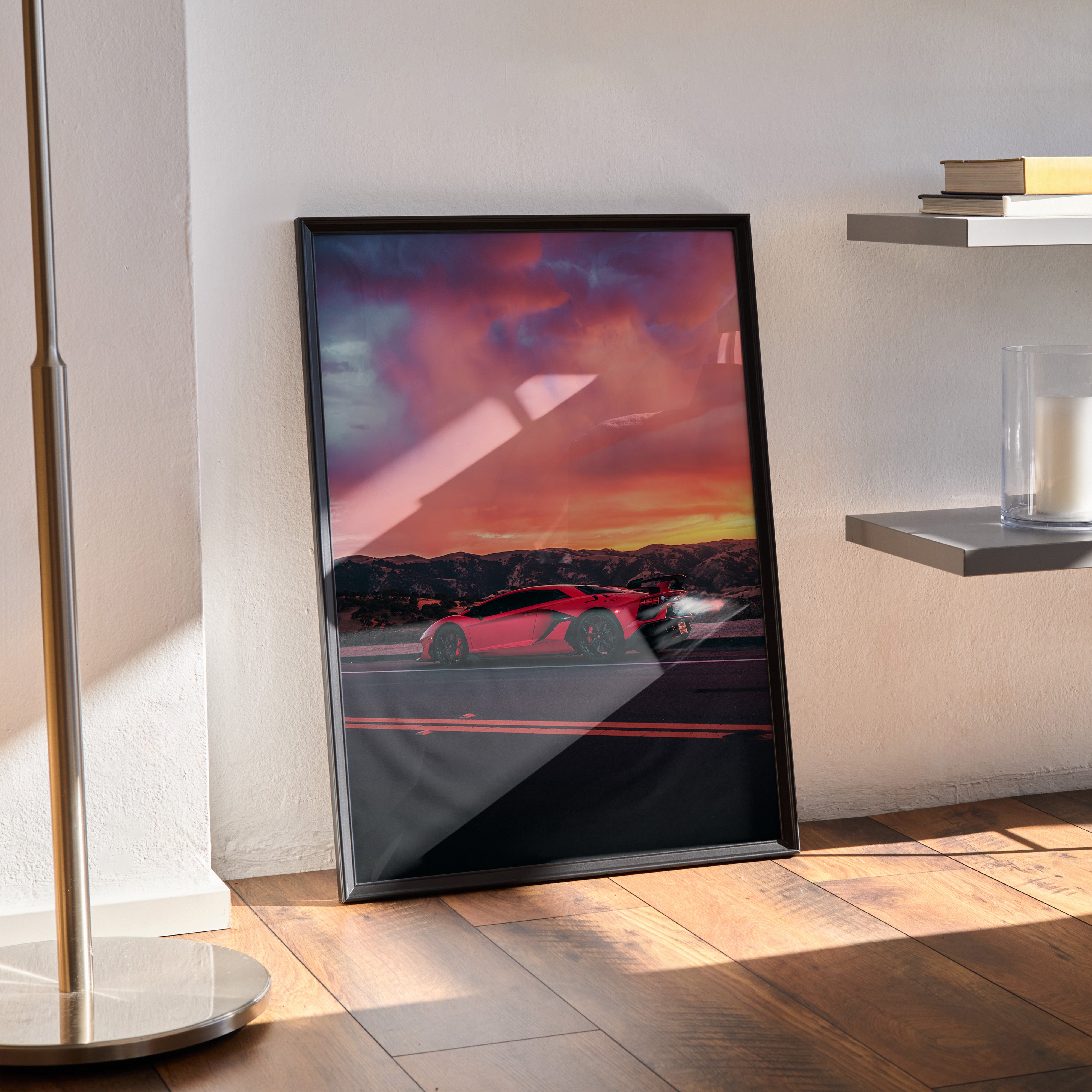 Lamborghini Aventador SVJ poster with sunset sky in black frame leaning on wall, modern wall art.