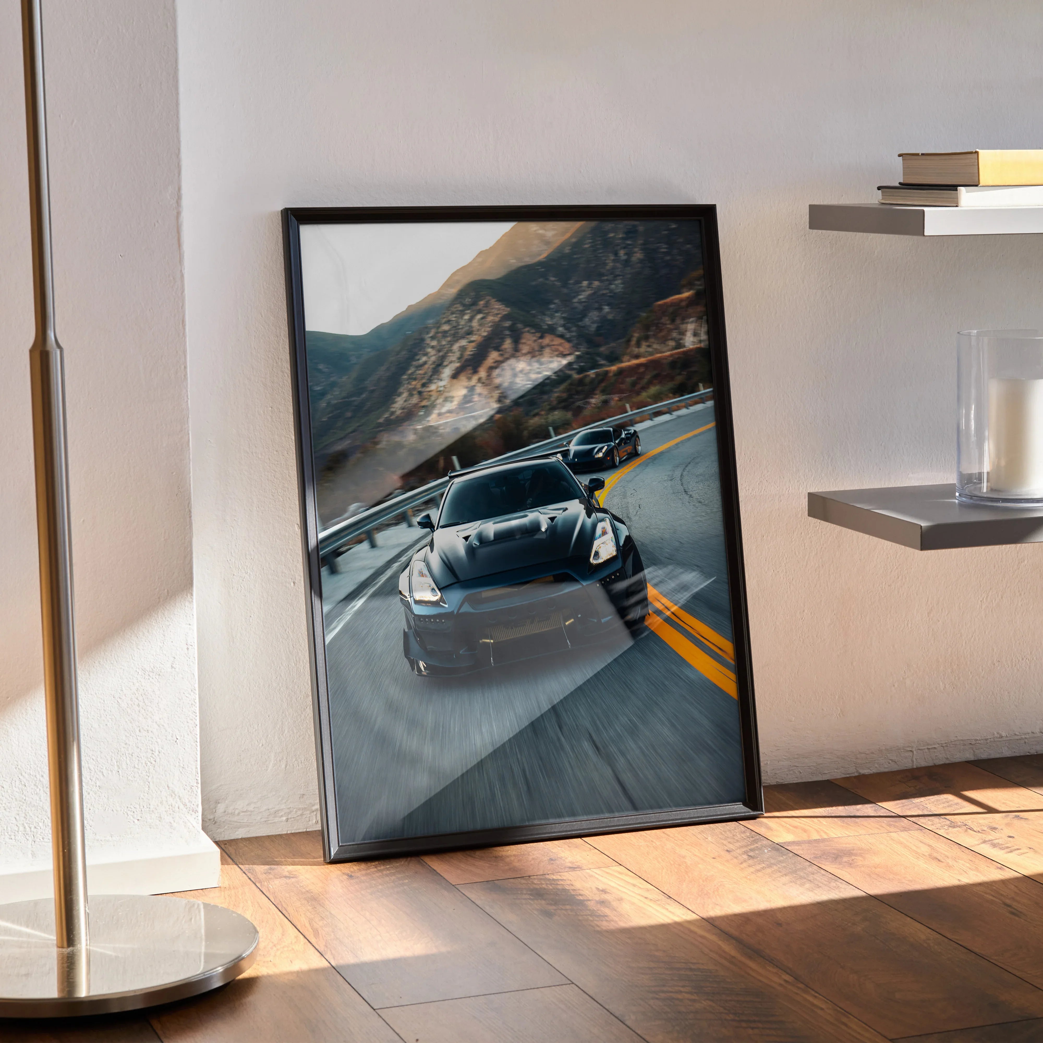 Nissan GTR R35 widebody driving on mountain road poster wall art in black frame.