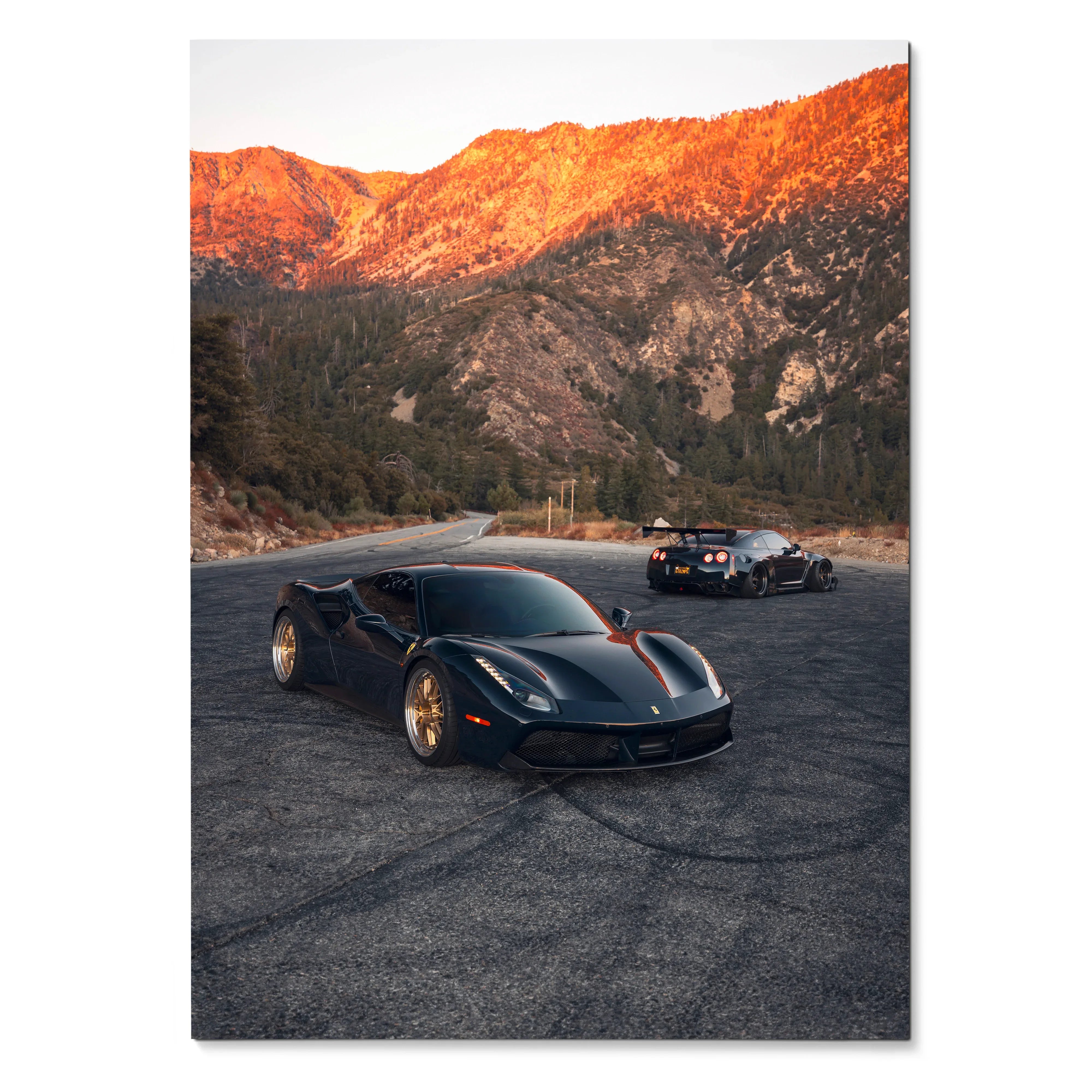 High-resolution poster of black Ferrari 488 GTB and Nissan GTR R35 supercars on mountain road wall art.