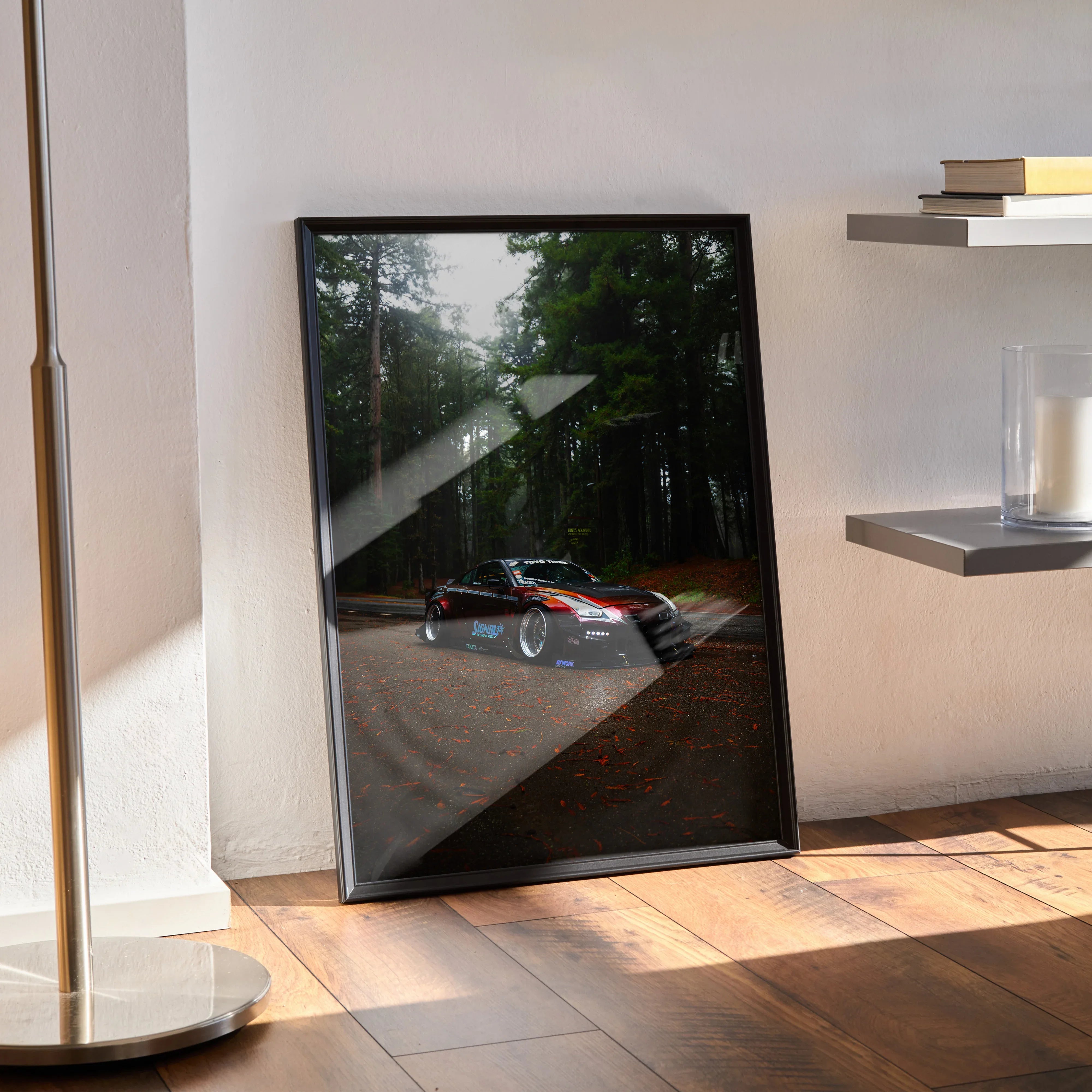 Nissan GT-R R35 racing car poster with black frame leaning against wall, premium wall art.