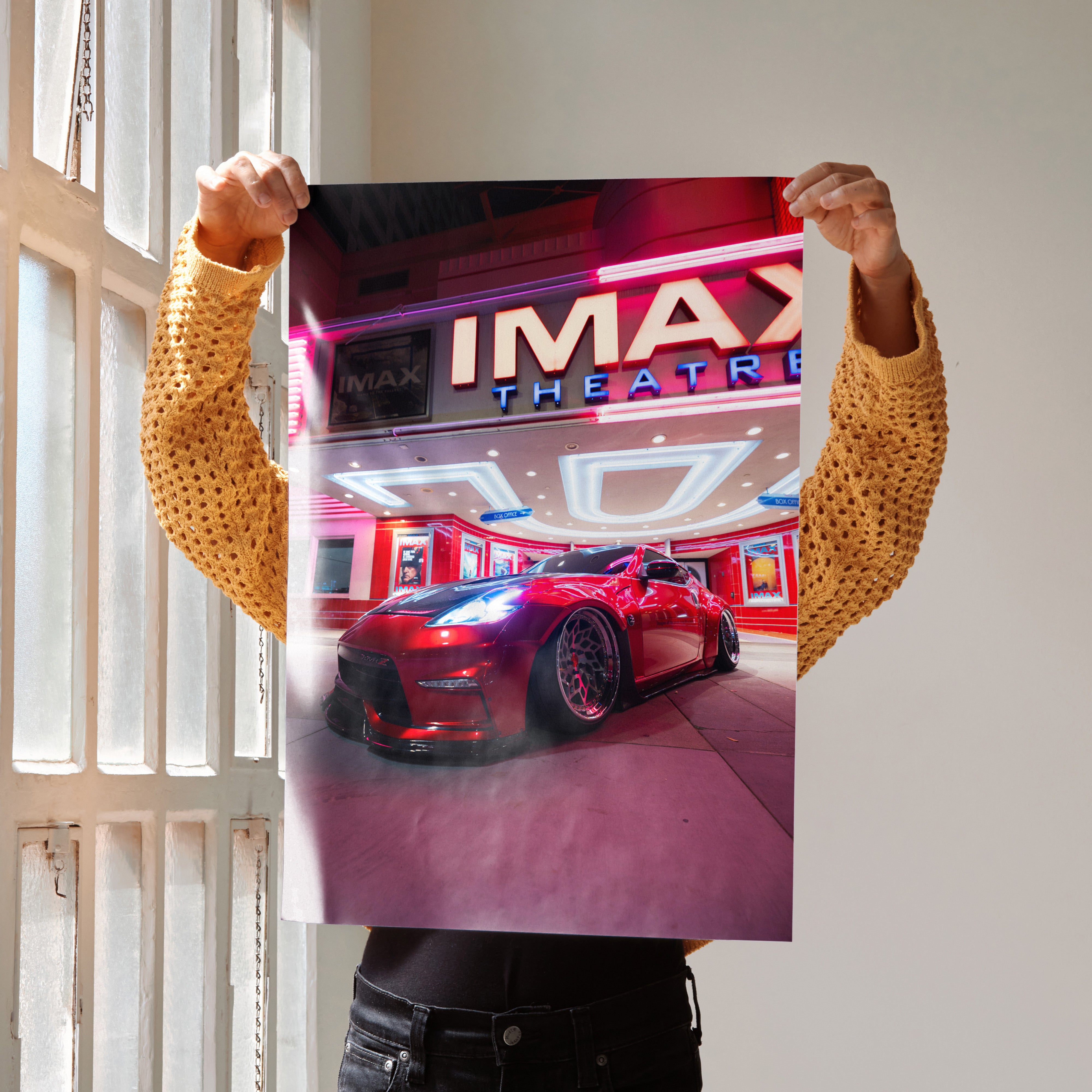 Nissan 370z JDM red sports car parked under illuminated IMAX Theatre neon lights poster wall art.