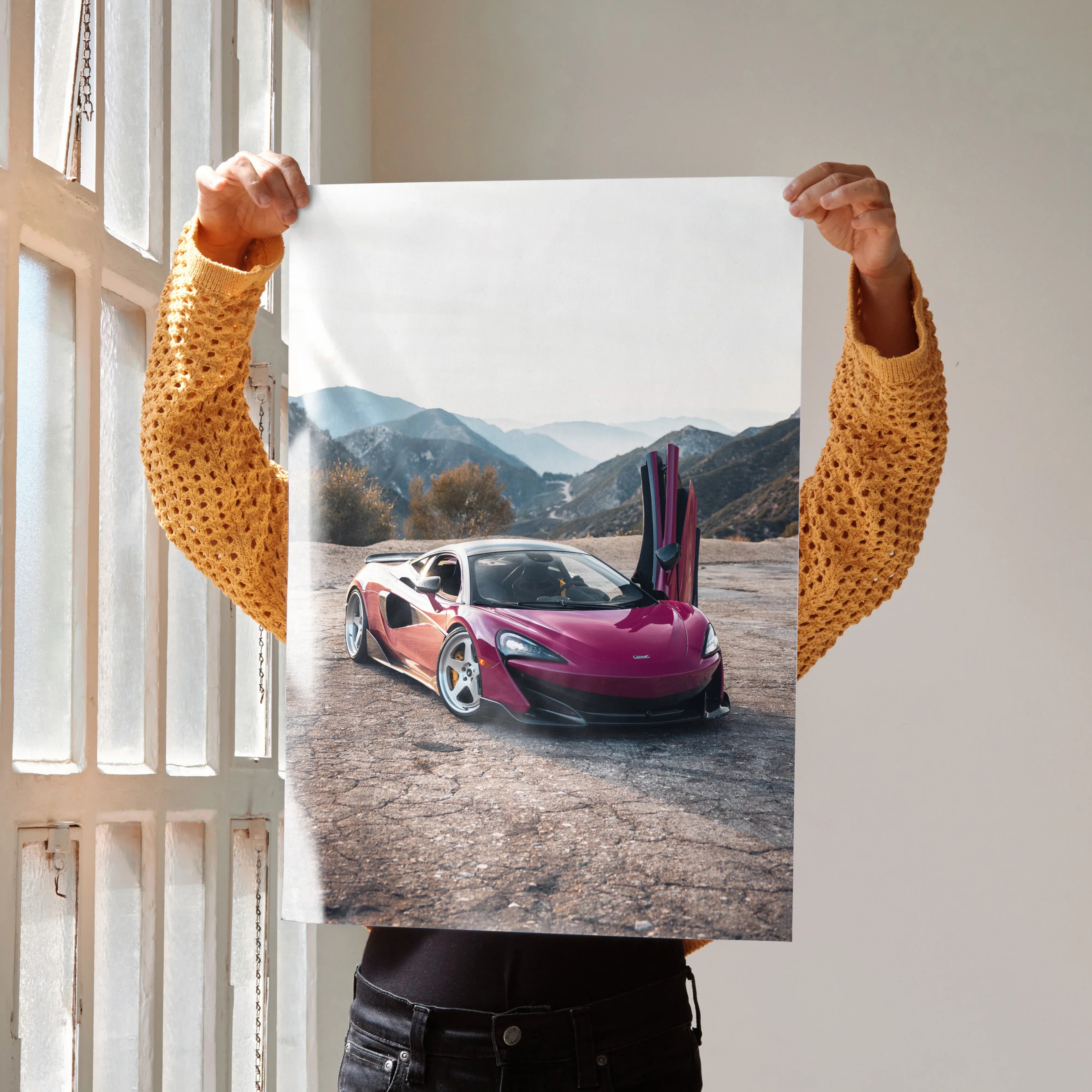 McLaren 600LT with open doors on mountain road poster wall art in vibrant colors.