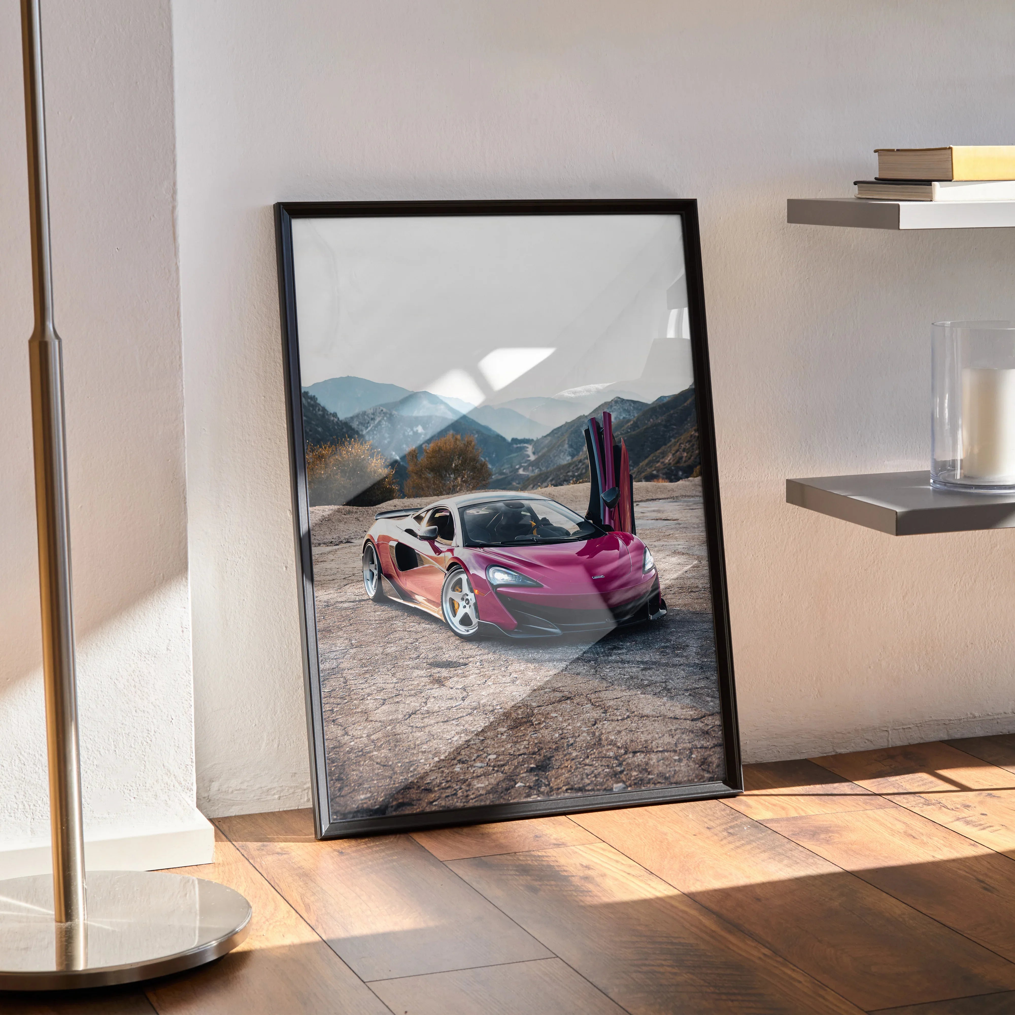 McLaren 600LT poster with passenger door open on mountain road, black frame wall art.