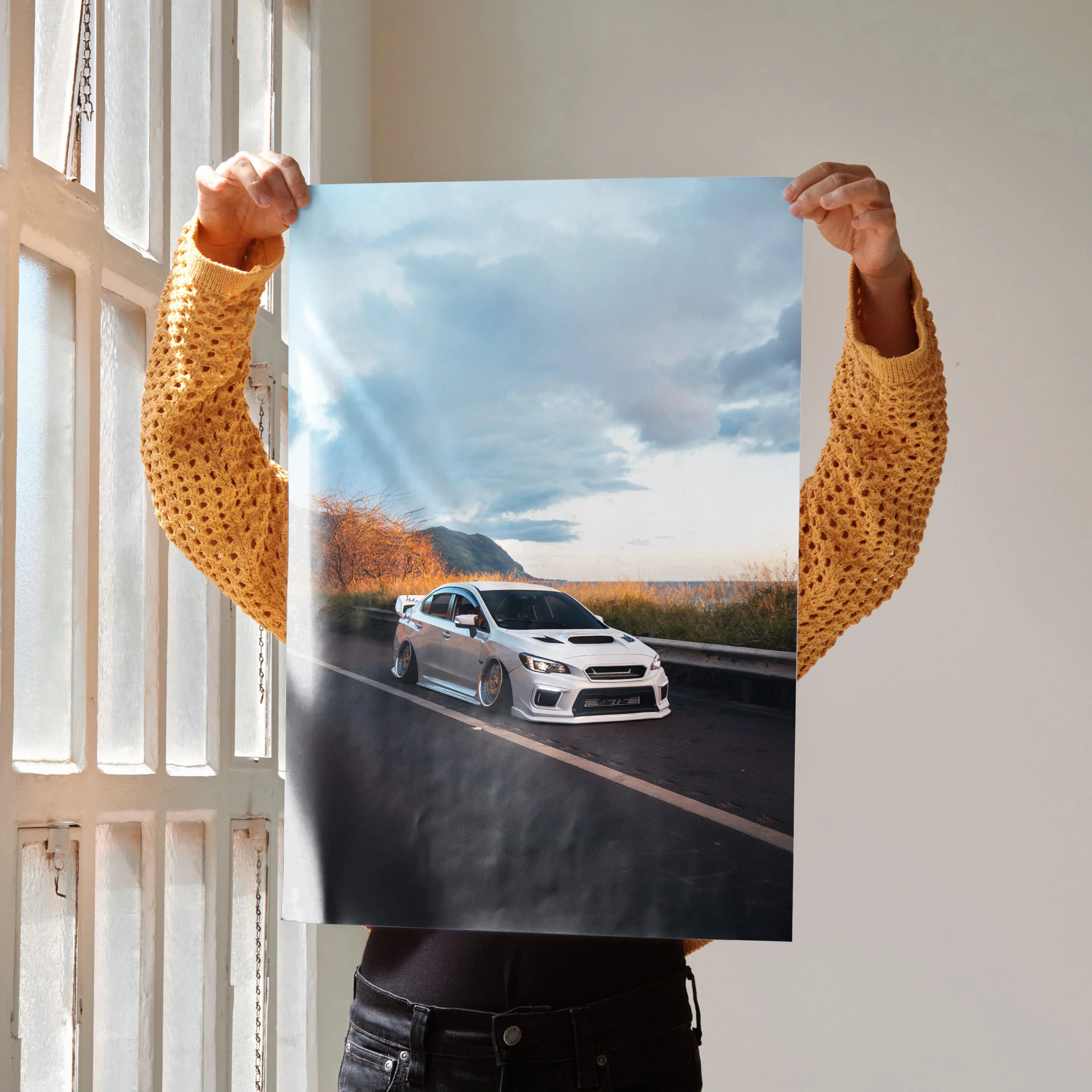Slammed white Subaru WRX on road under cloudy sky poster wall art.