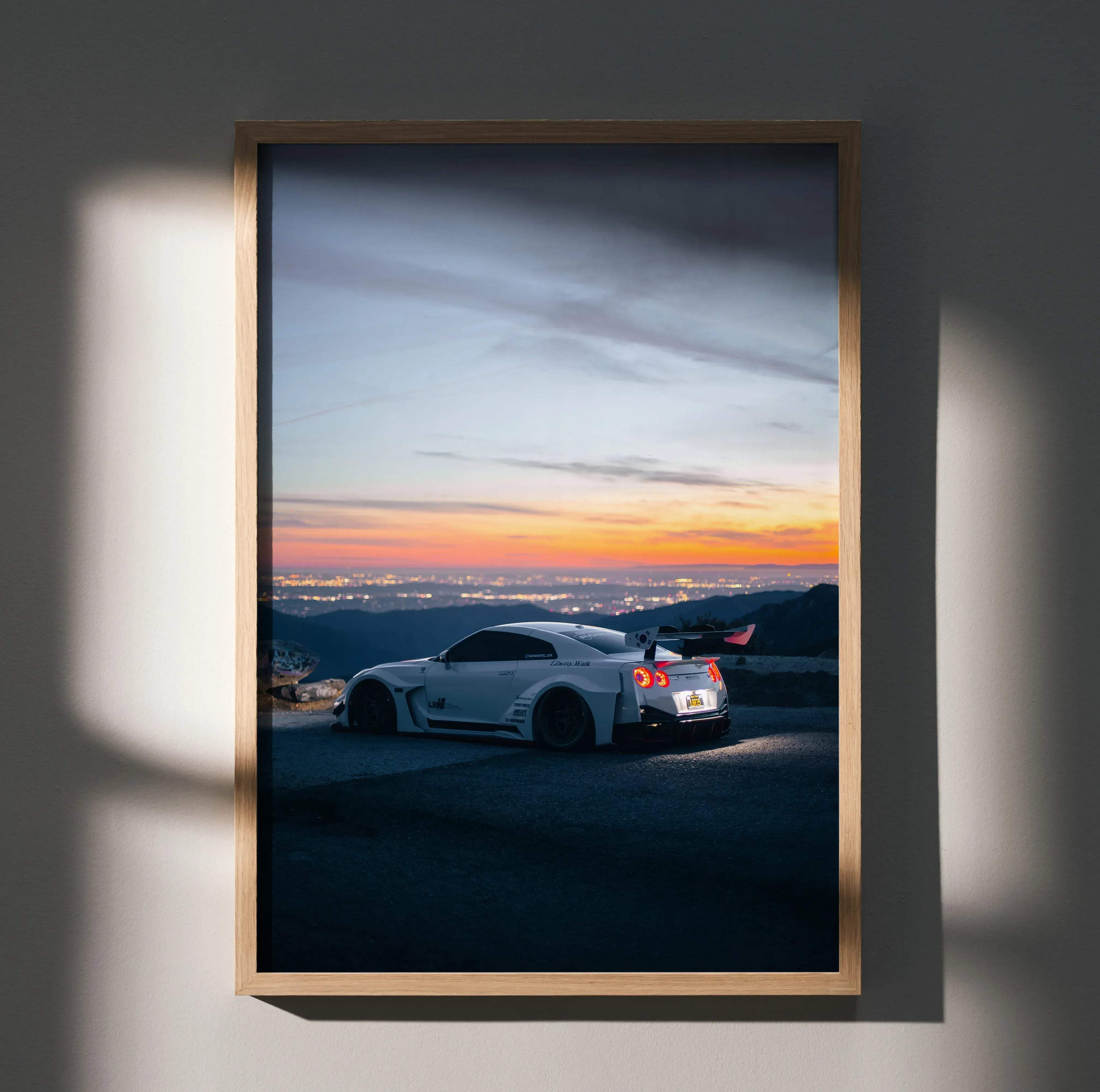 White nissan r35 gt-r sports car with rear spoiler and red taillights at sunset cityscape wall art poster