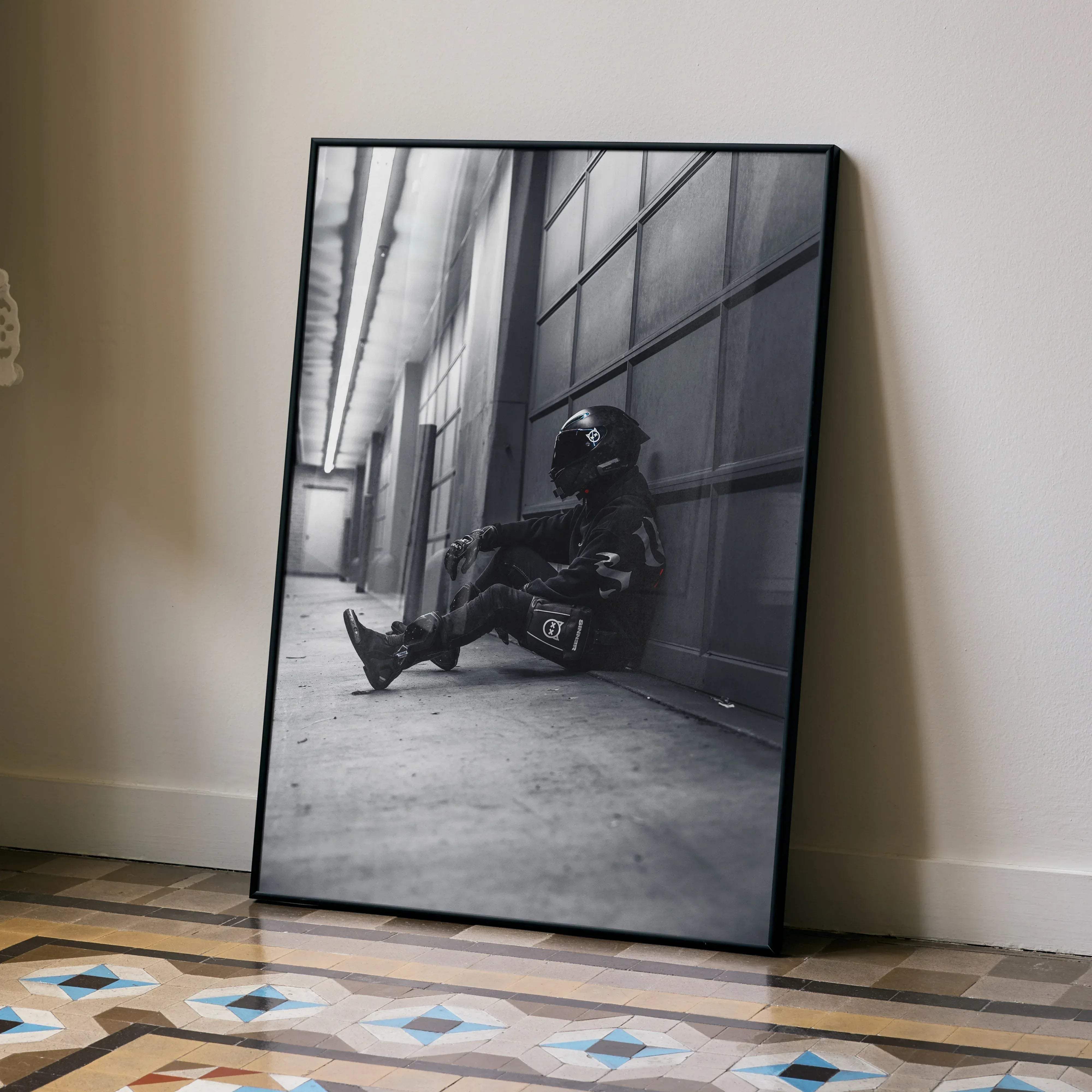 Black-framed black and white photo print of motorcyclist in full gear with agv pista helmet on yamaha r6 motorcycle