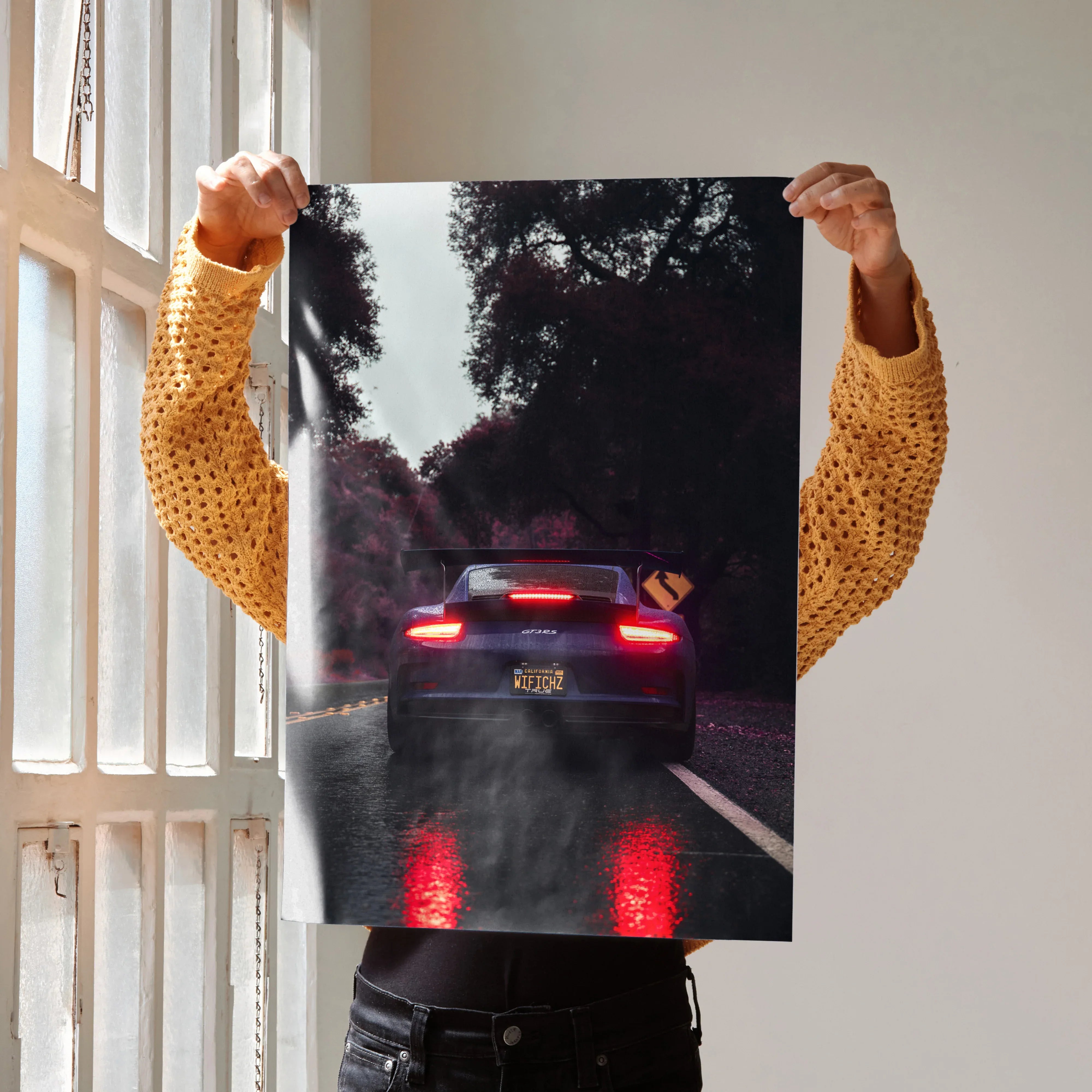 Porsche 911 GT3 RS poster showing rear view with glowing taillights on wet road, wall art with dark moody tones.
