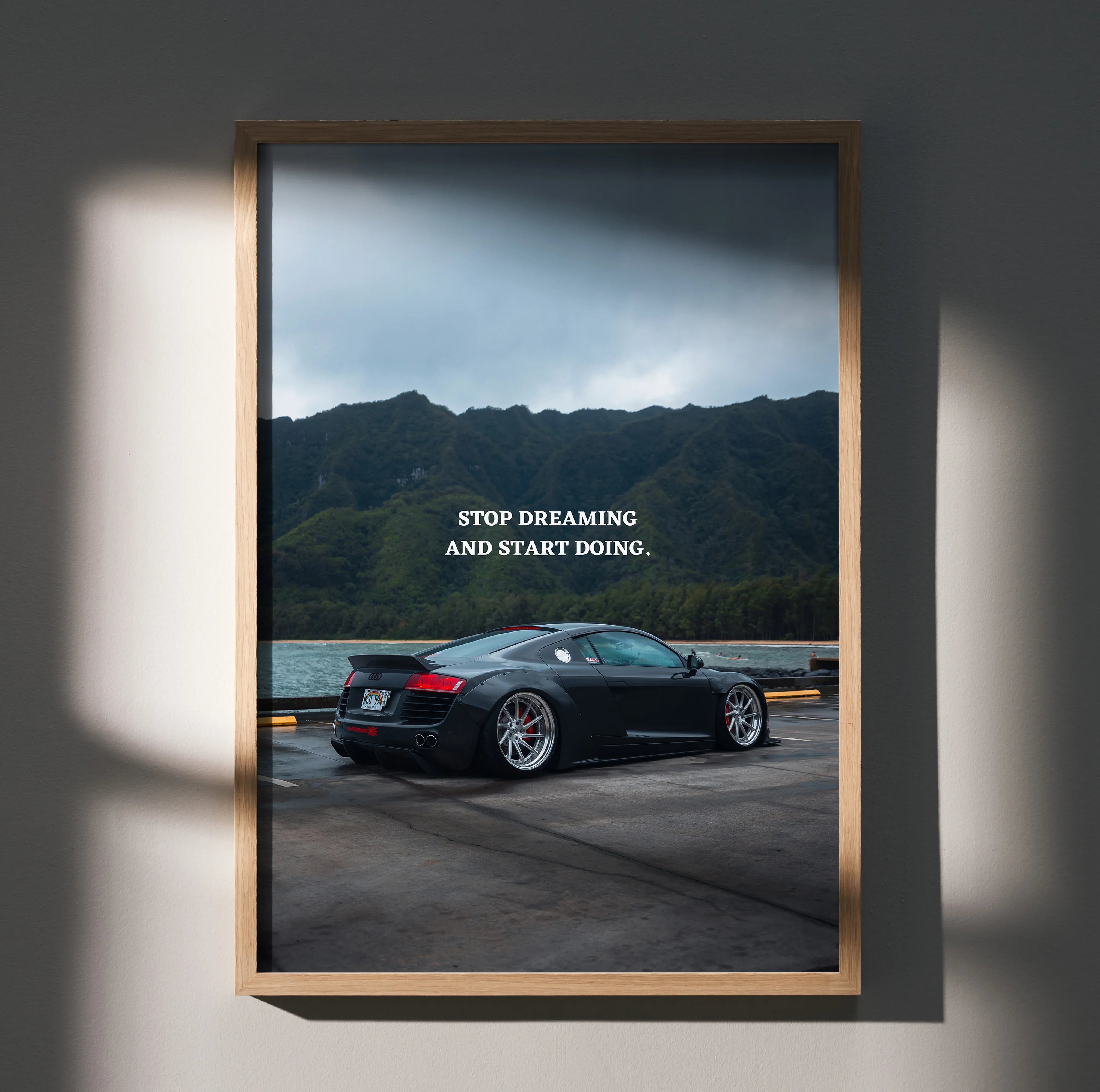 Audi R8 poster wall art with inspiring "Stop Dreaming and Start Doing" text and mountain backdrop.