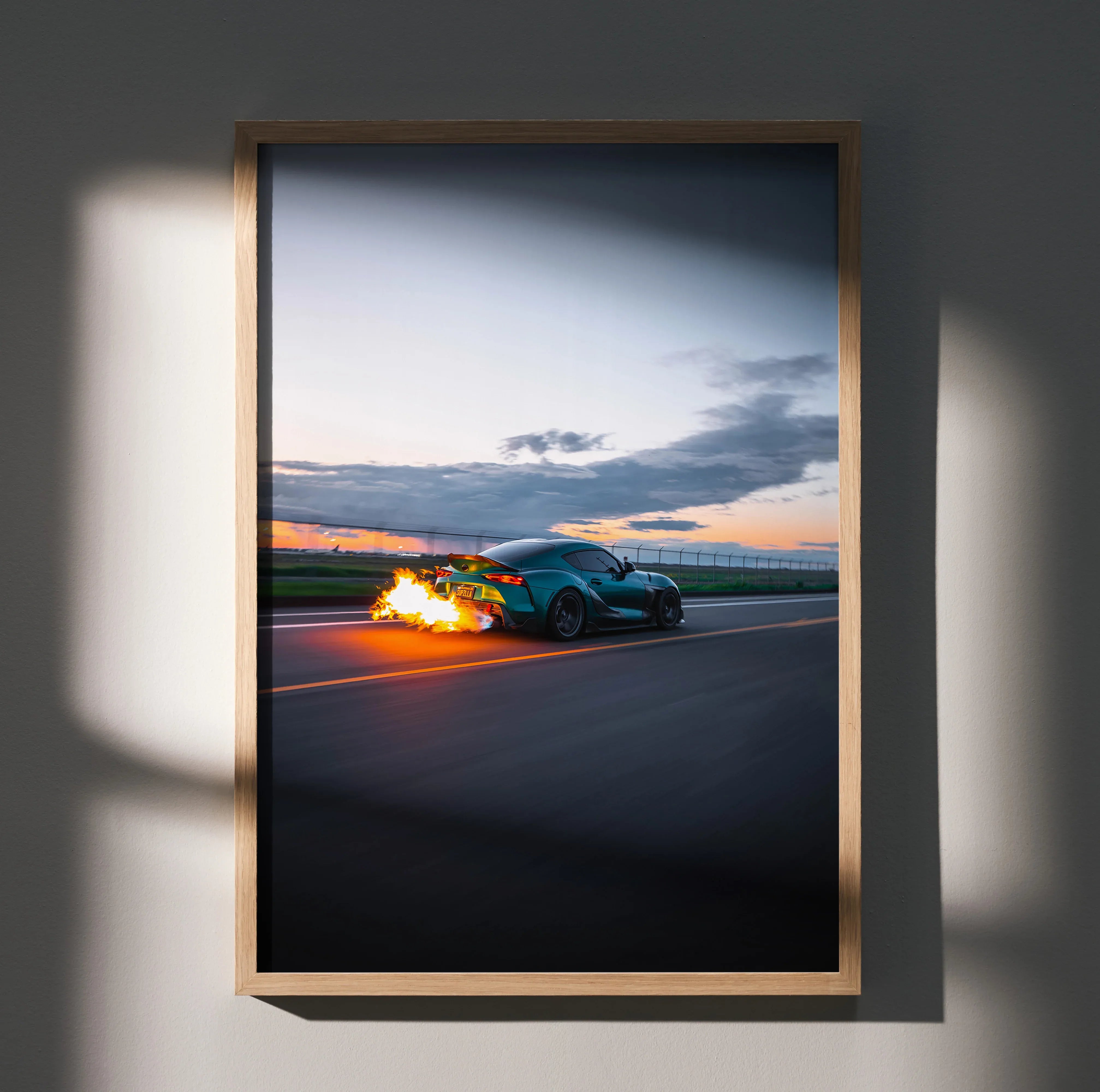 Toyota Supra Mk5 racing at sunset with flames from exhaust, premium poster wall art.