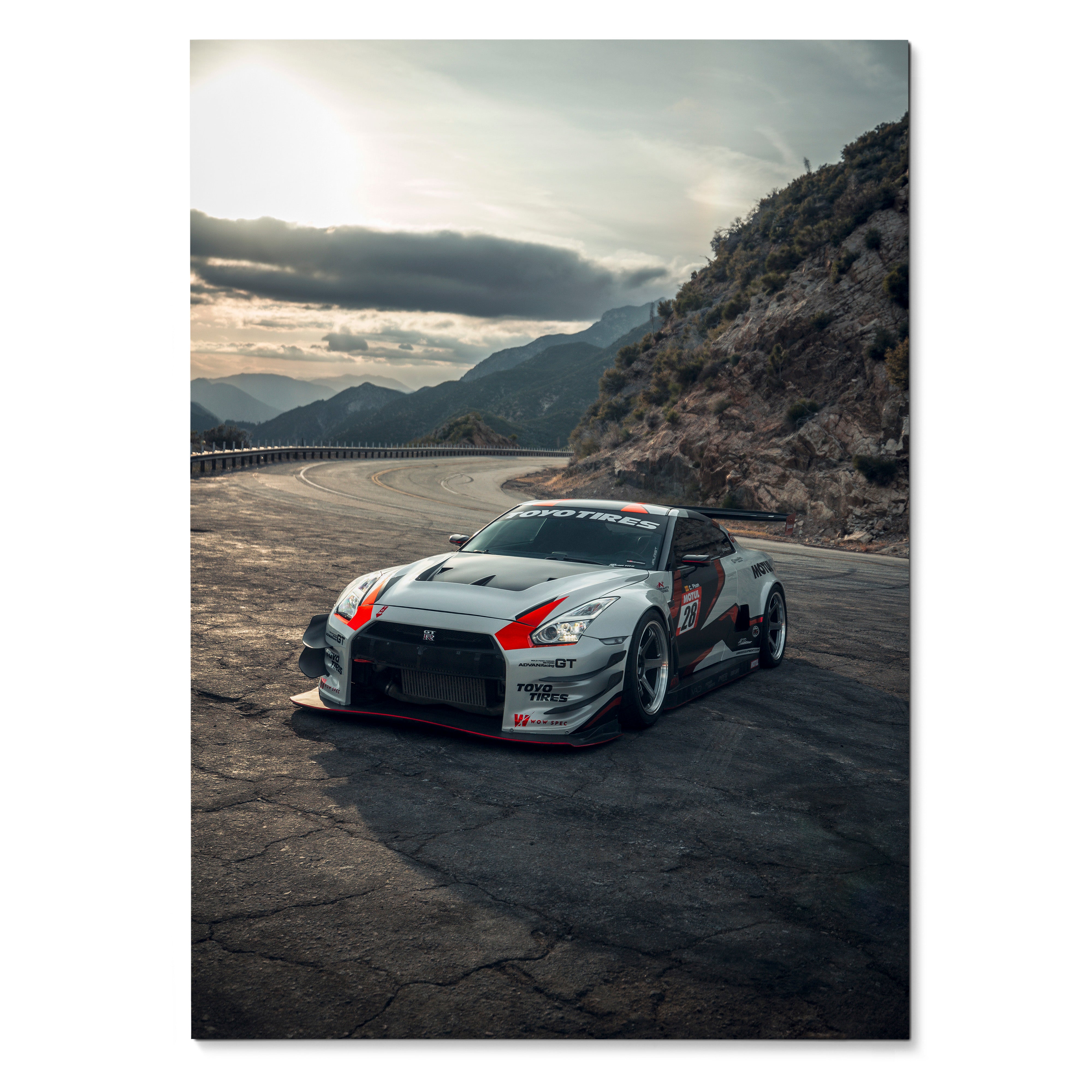 Nissan GTR R35 racing car on cracked asphalt with mountainous background poster wall art.