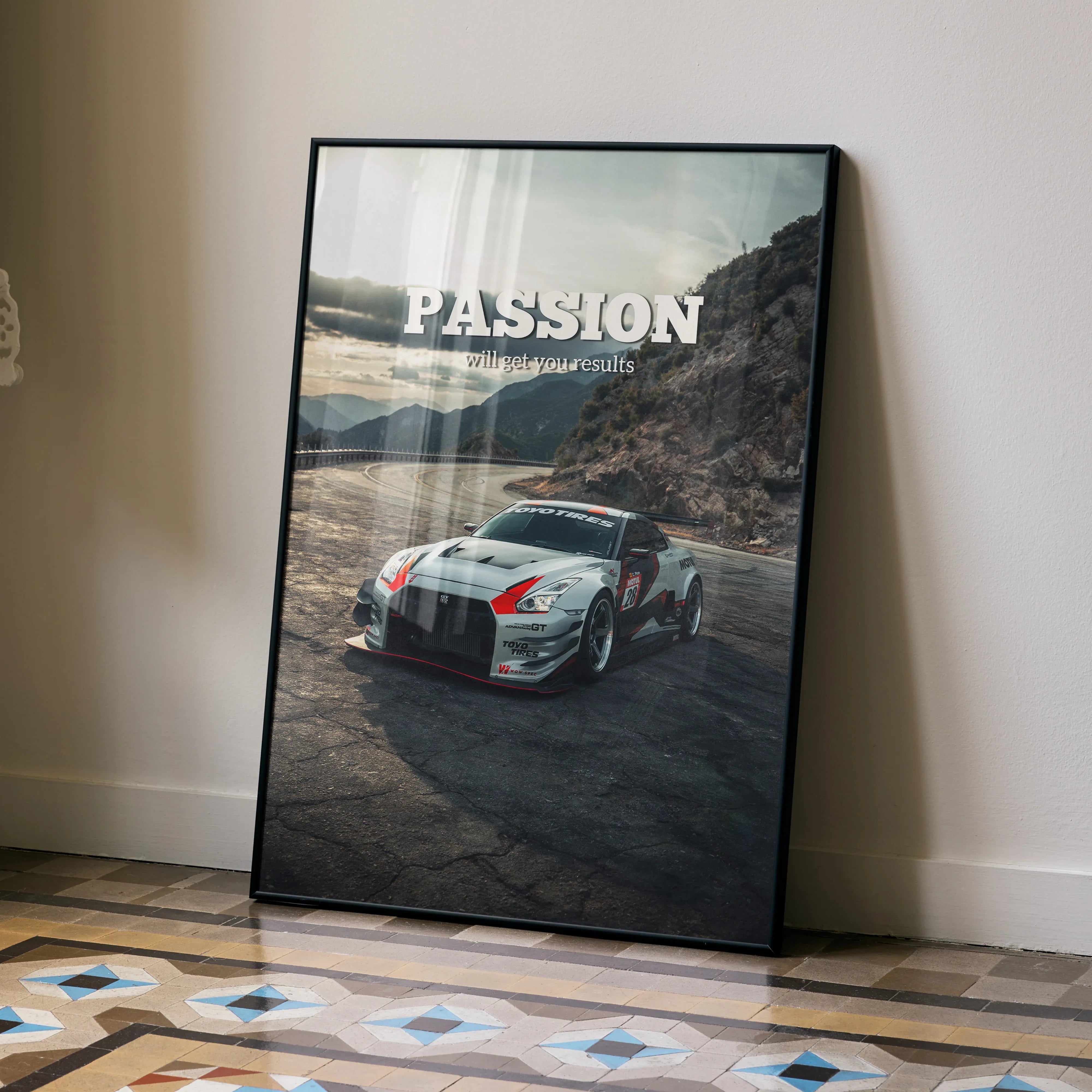 Nissan R35 GT-R on rugged terrain with "PASSION" motivational text poster wall art in black frame.