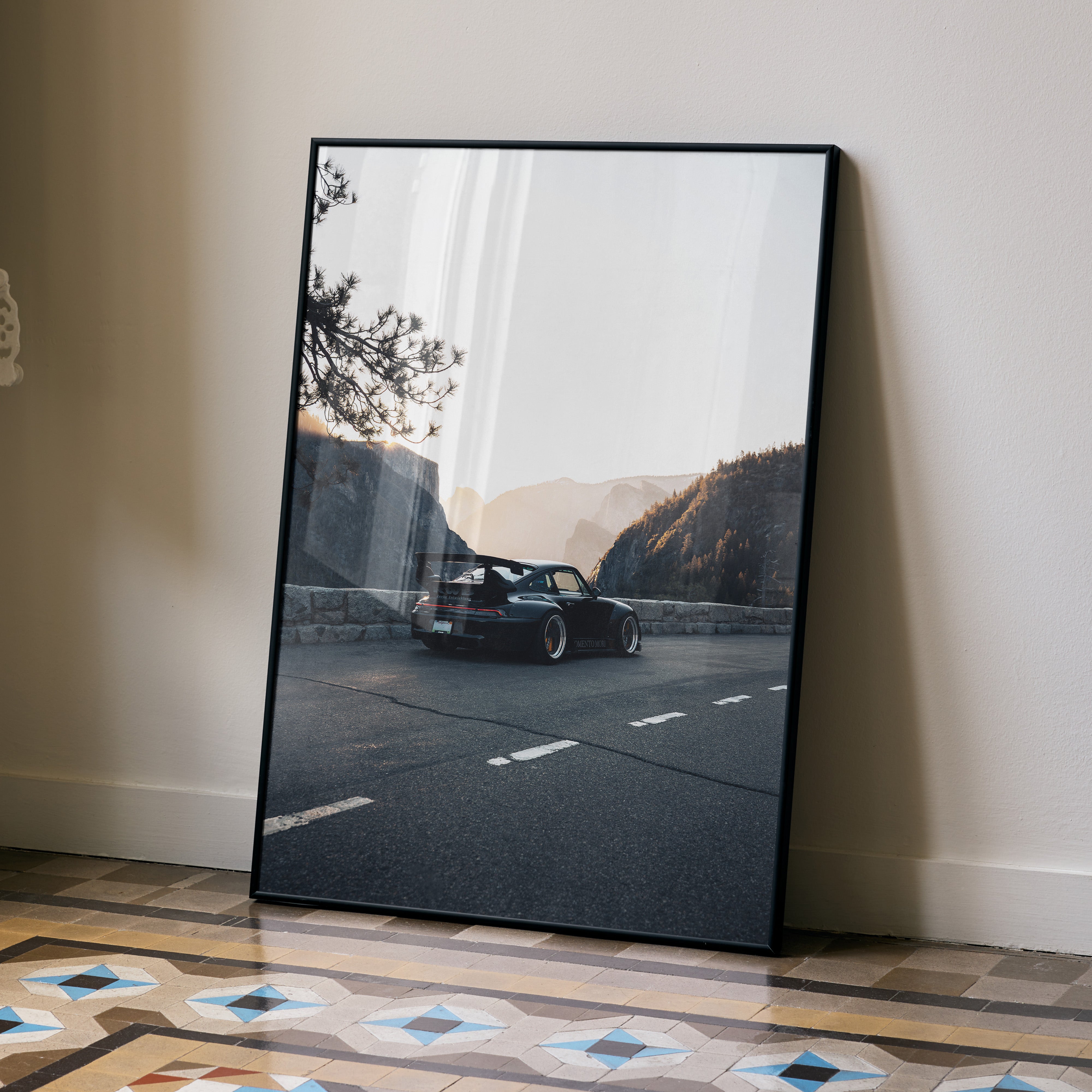 RWB Porsche 911 poster wall art featuring a sleek black car on a mountain road at sunset.