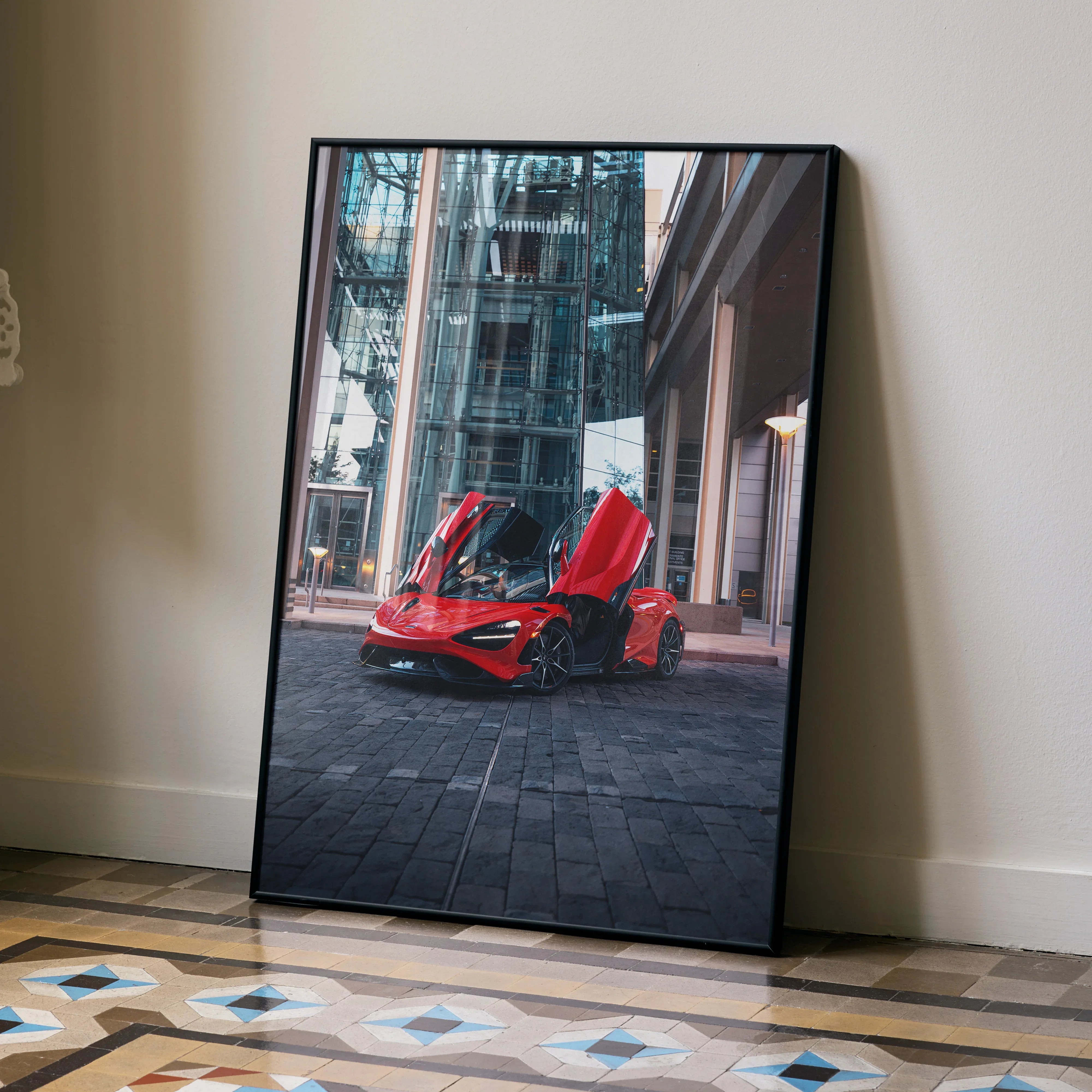 McLaren 765LT supercar with open butterfly doors parked on city street, modern architecture background poster wall art.