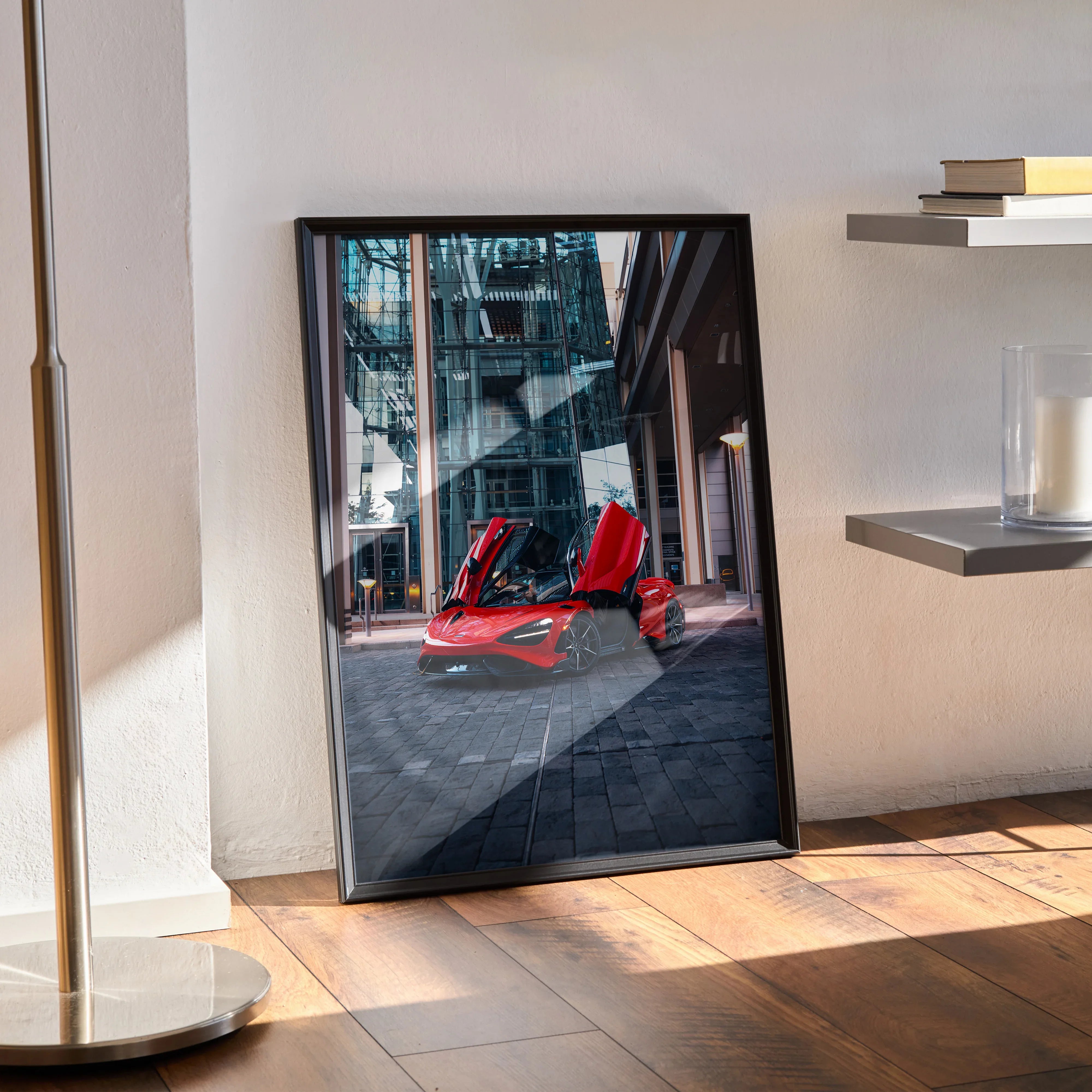 McLaren 765LT supercar with open doors in urban setting, vibrant red poster wall art in black frame.