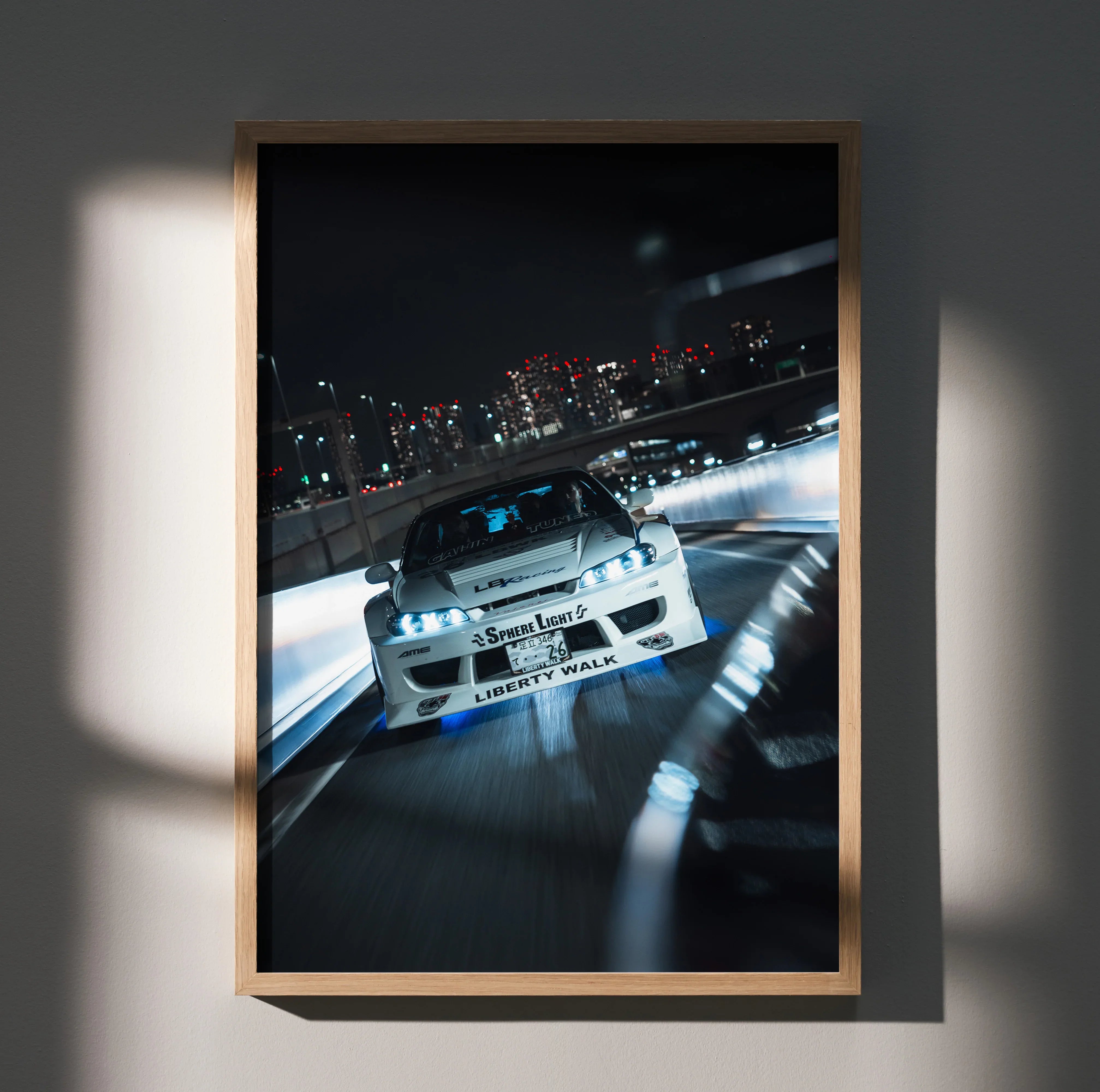 Nissan Silvia S15 racing at night cityscape poster wall art in black frame.