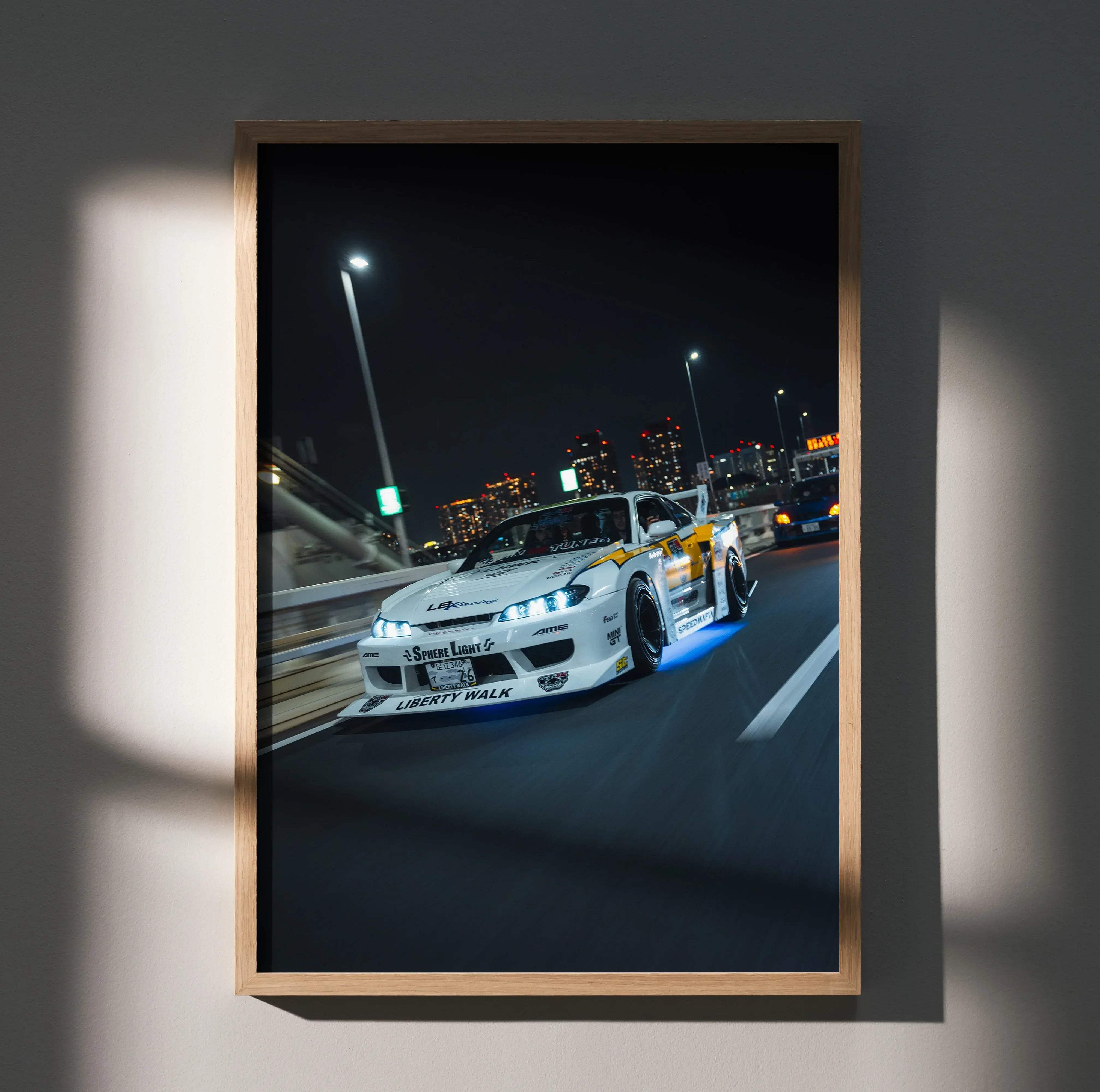 A framed high resolution poster of a white and yellow Nissan Silvia S15 drift car with blue underglow and Liberty Walk decals