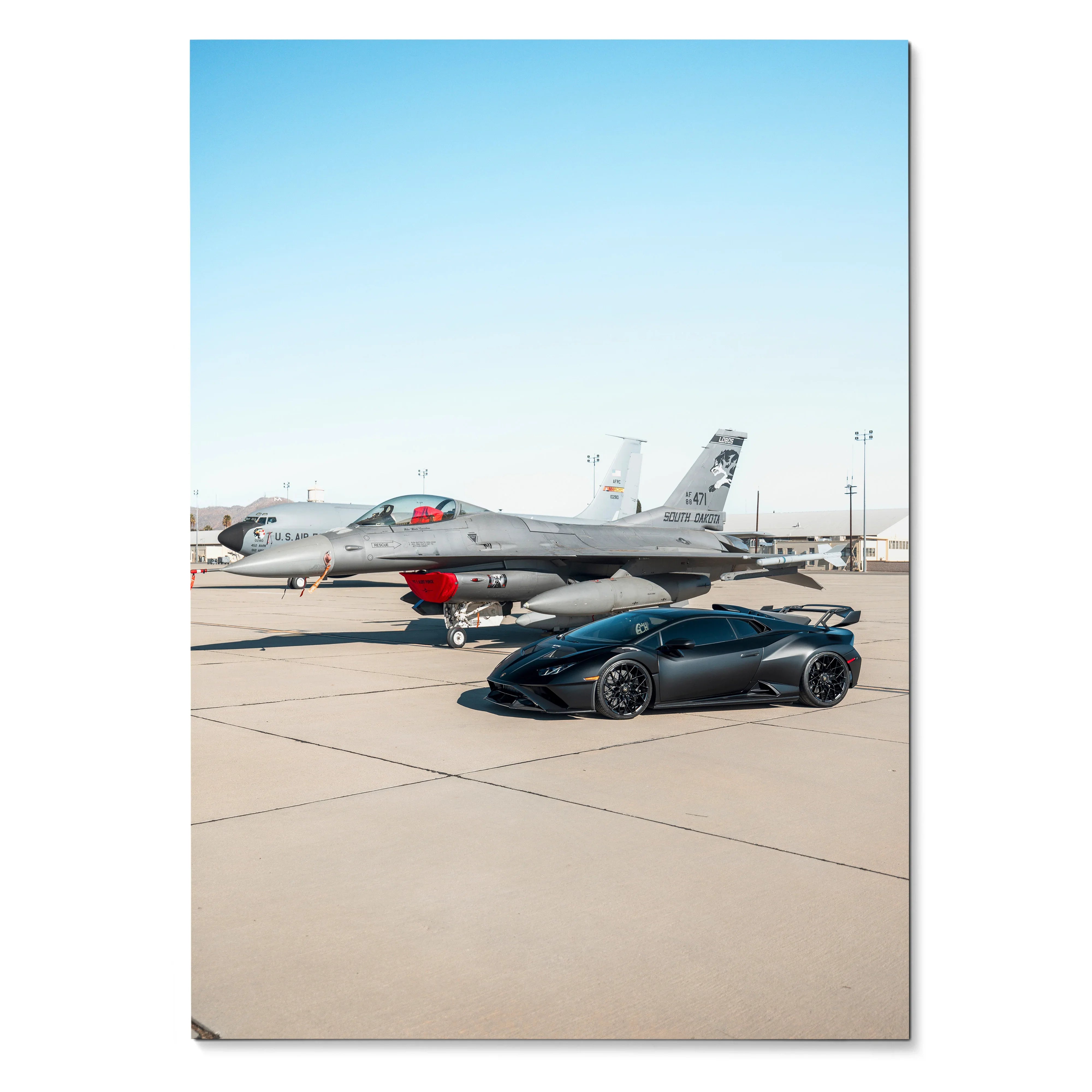 Lamborghini Huracan STO black sports car parked on runway with jet in background poster wall art.
