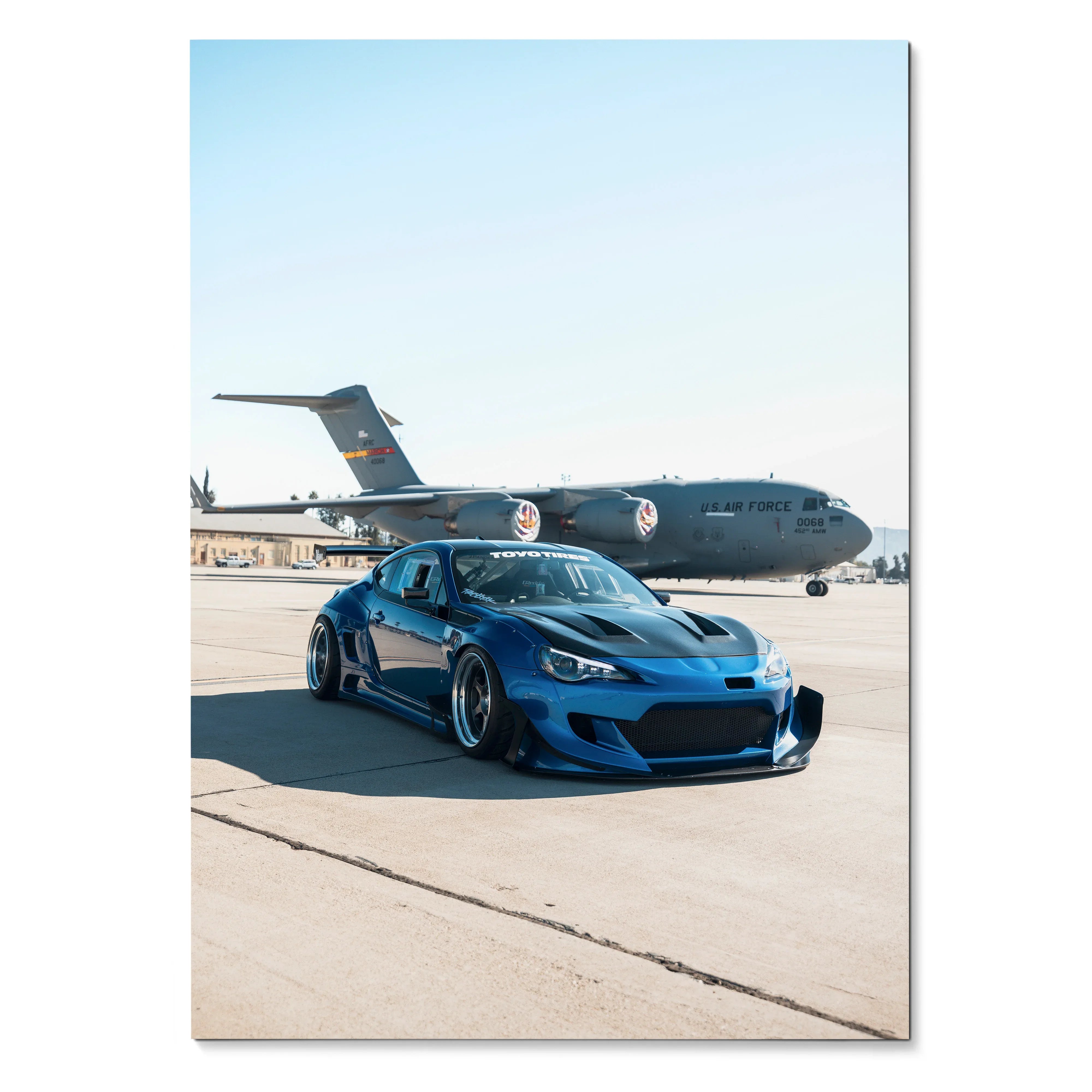 Sleek widebody blue Toyota FRS car poster with airplane background wall art decor.