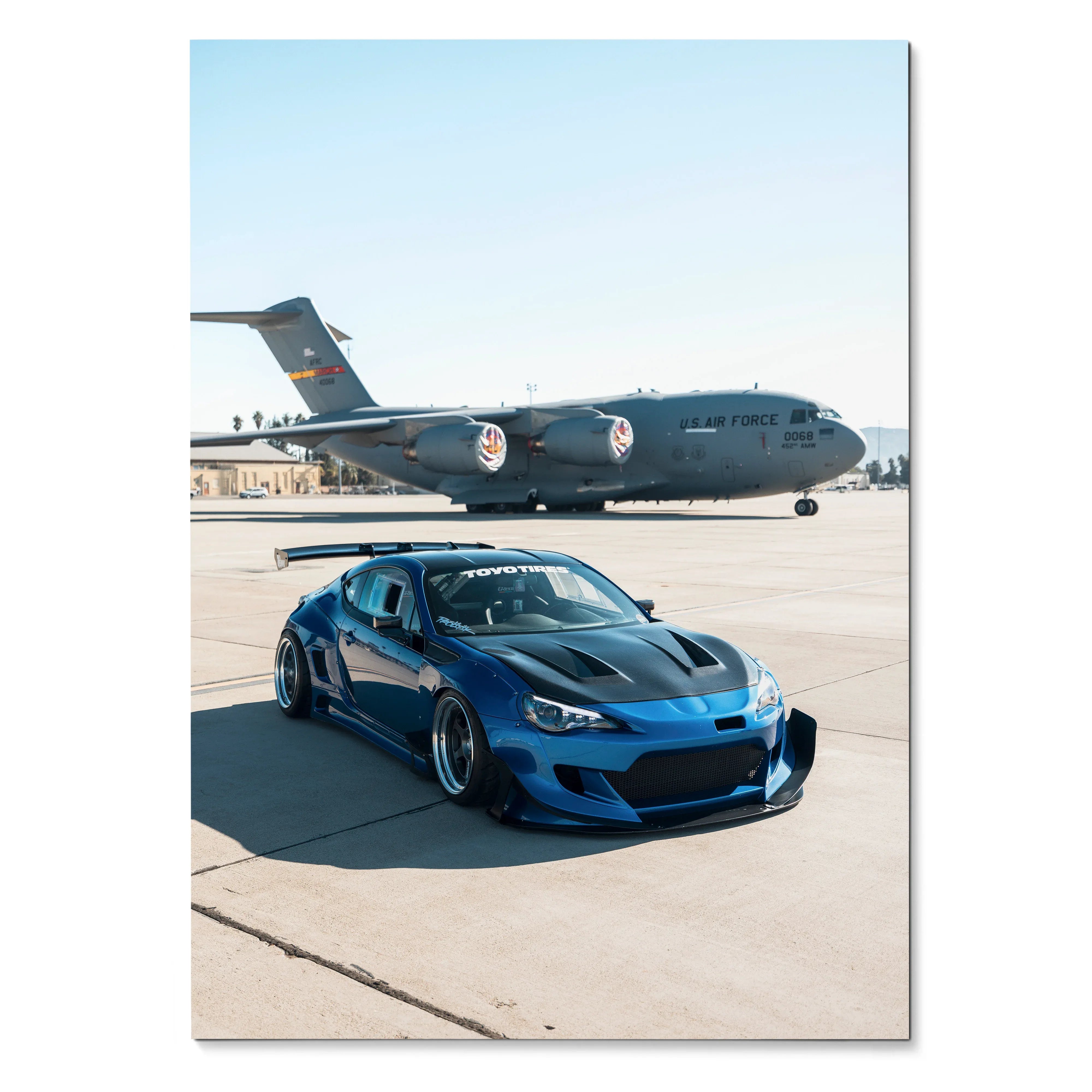 Blue Toyota FRS car poster with military cargo plane background, high-resolution wall art.
