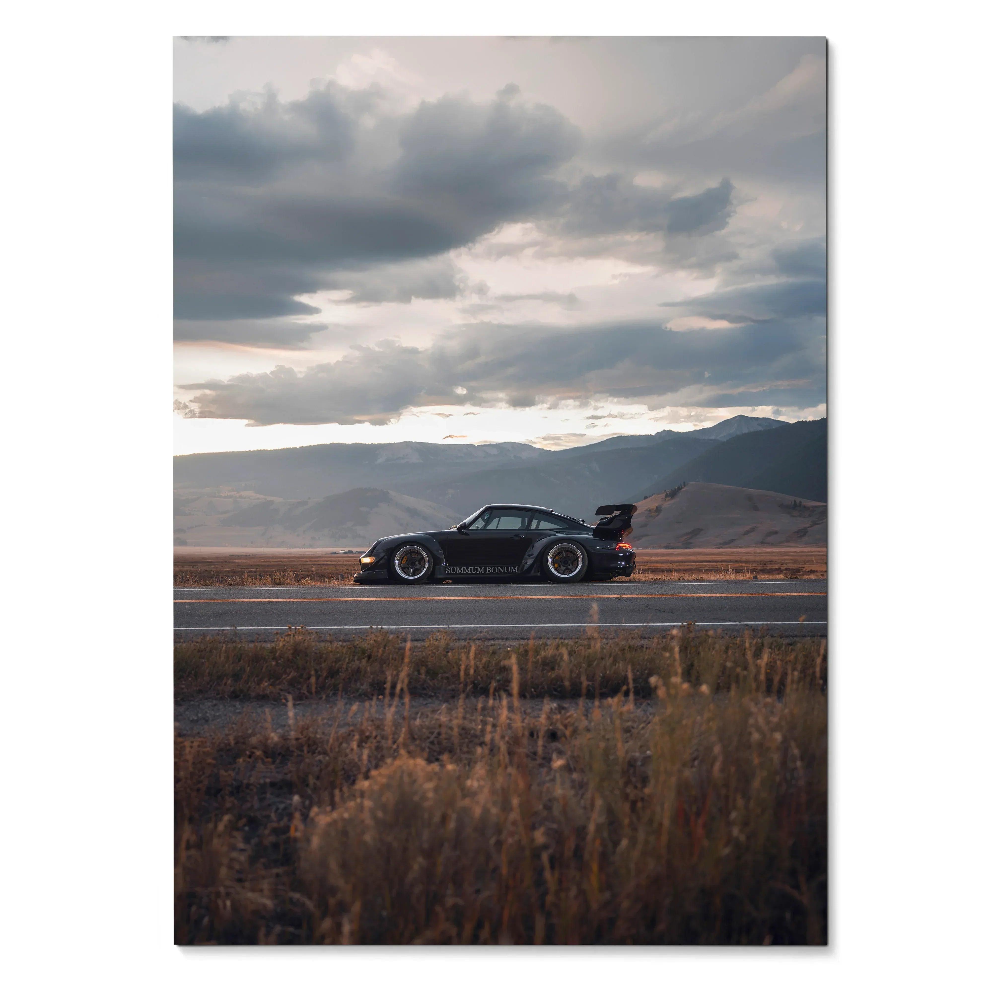 RWB Porsche 911 side view on scenic road with dramatic cloudy sky poster wall art.