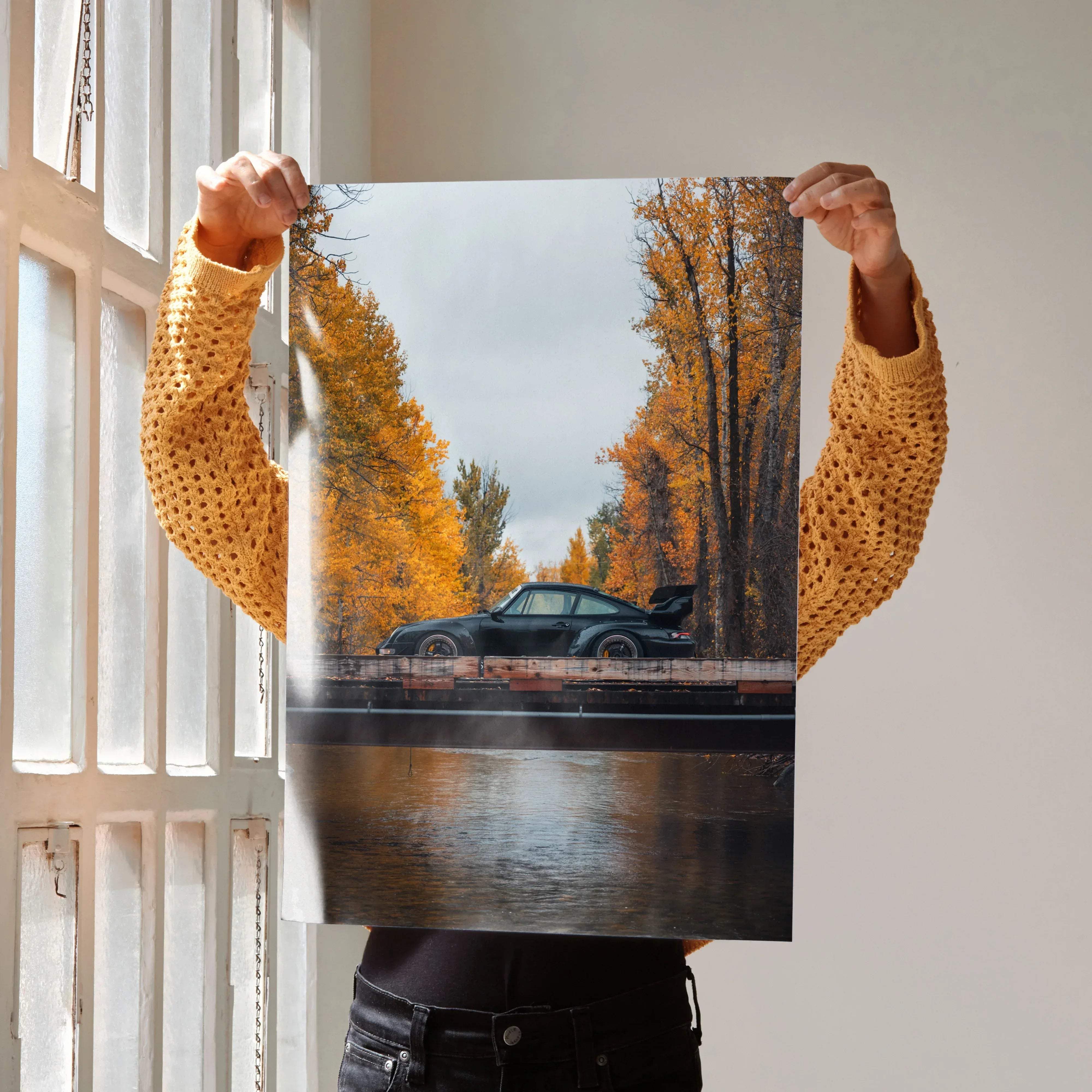 A black RWB Porsche 911 sports car poster featuring vibrant autumn trees reflected on water in high resolution