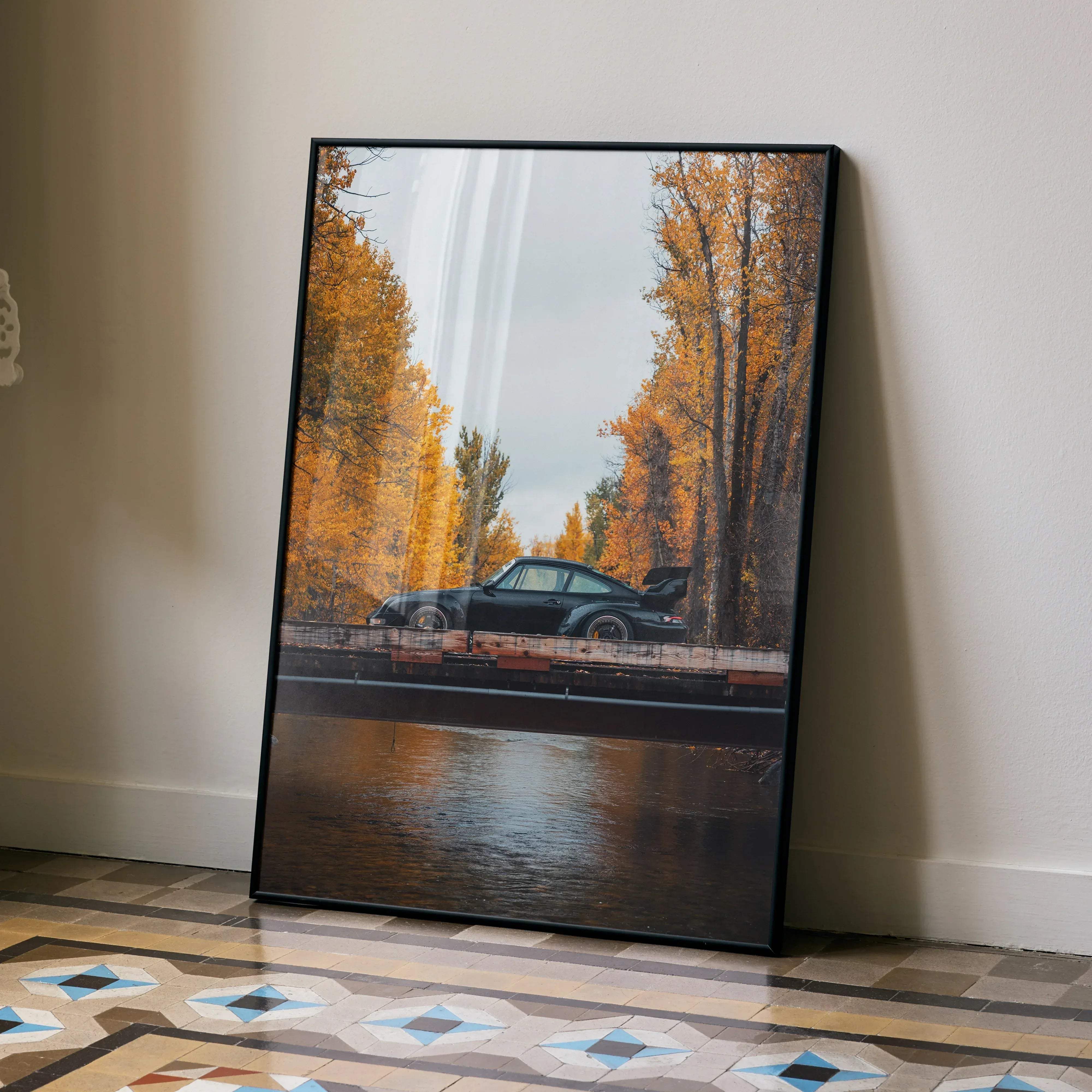 Black framed art print of sleek black porsche 911 sports car on bridge with autumn golden trees rwb porsche 911 poster 008