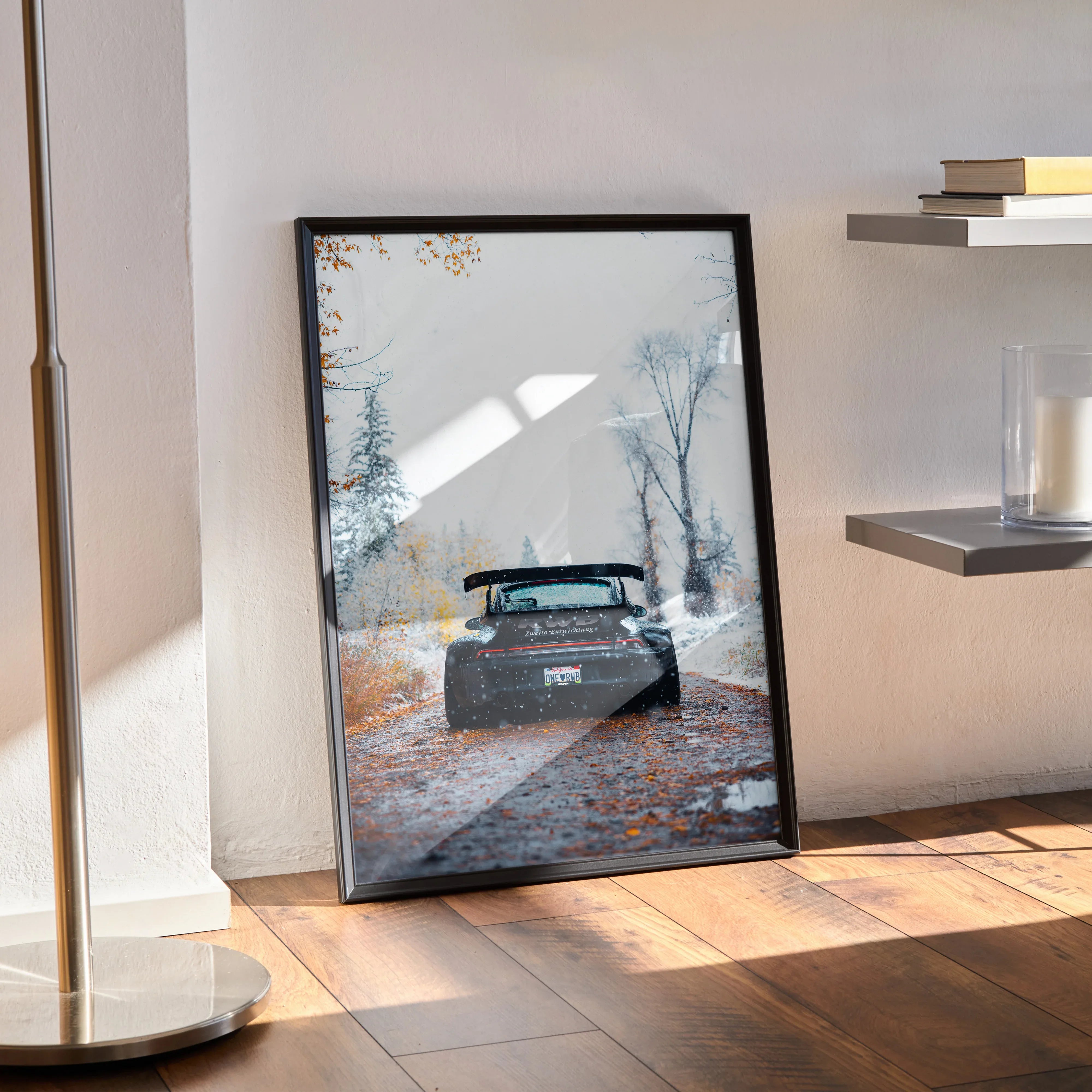 RWB Porsche 911 car poster with autumn forest background, framed wall art on floor.