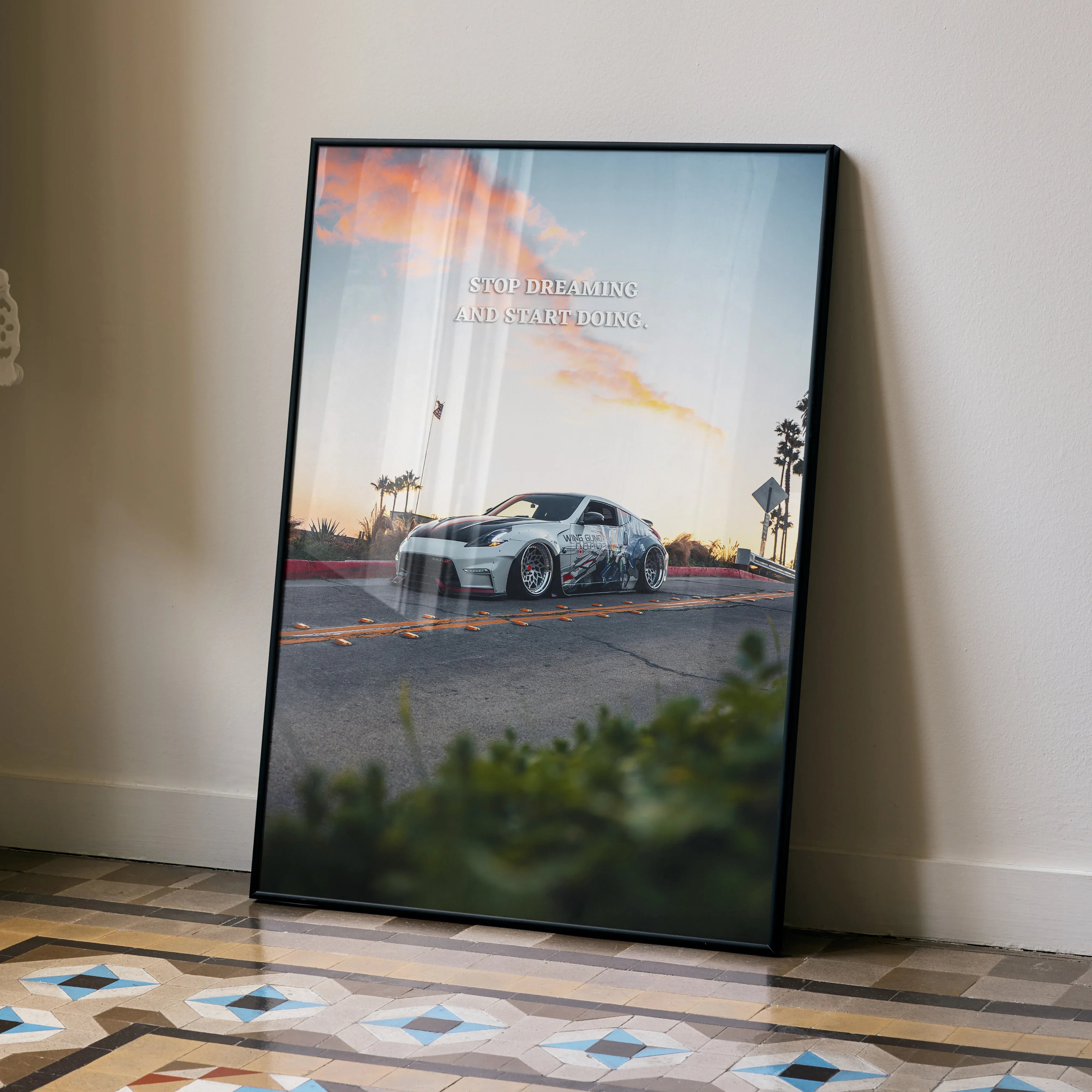 Nissan 370z parked on urban street at sunset motivational poster wall art in black frame.