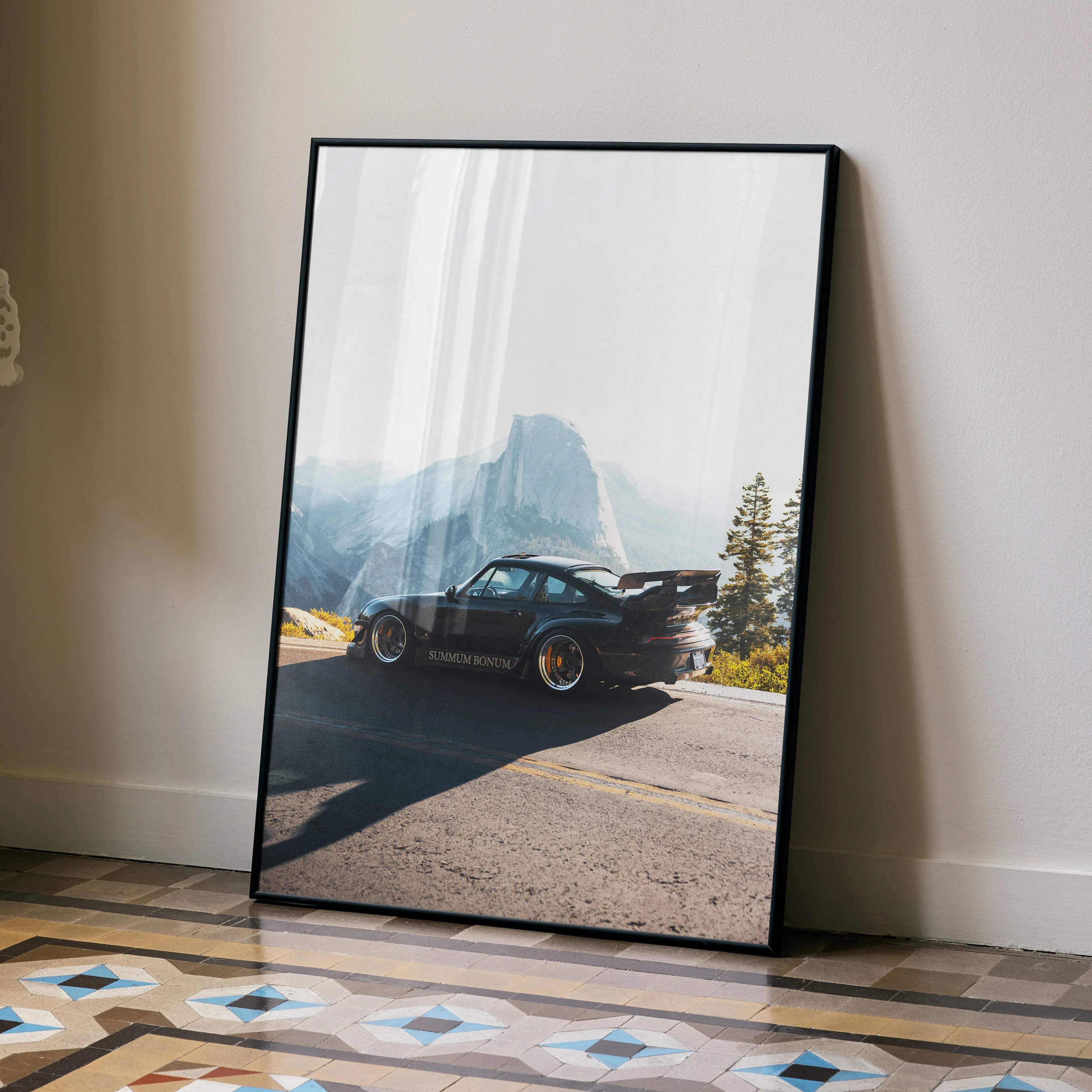 Black framed poster of matte black porsche 911 with gold rims and sunrise bonds text rwb porsche 911 wall decor
